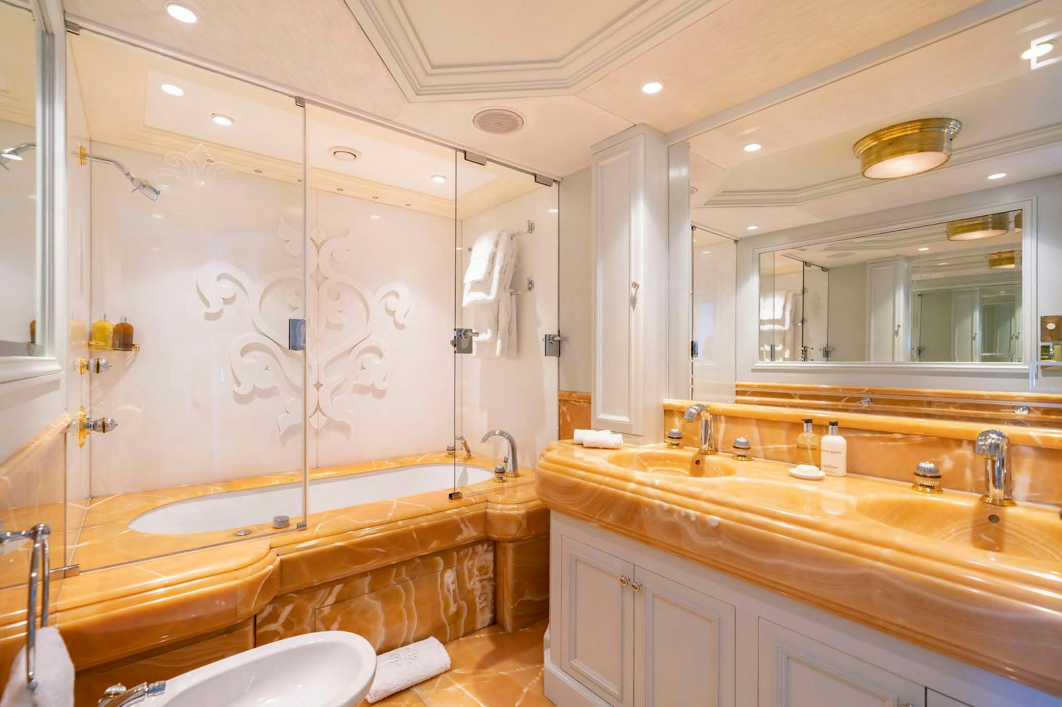 a bathroom with a large bathtub aboard MOSAIQUE Yacht for Sale