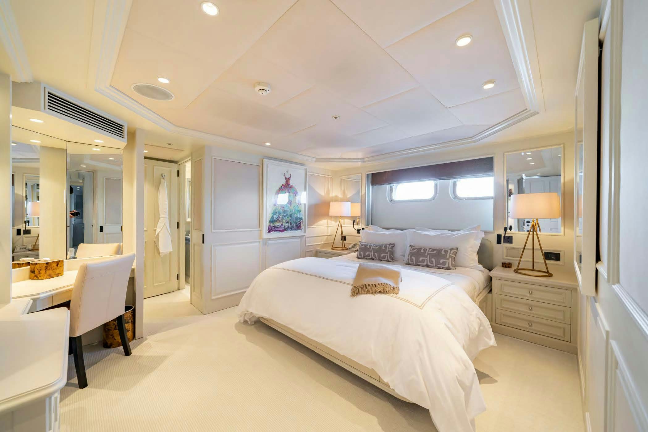 a bedroom with a large bed aboard MOSAIQUE Yacht for Sale