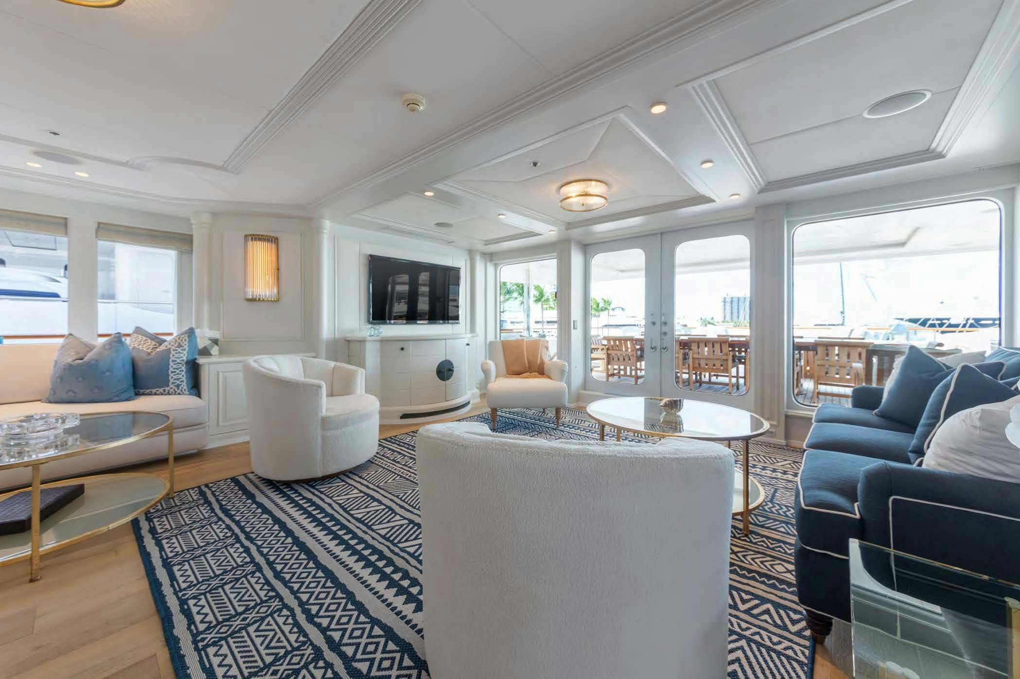 a living room with a large window aboard MOSAIQUE Yacht for Sale