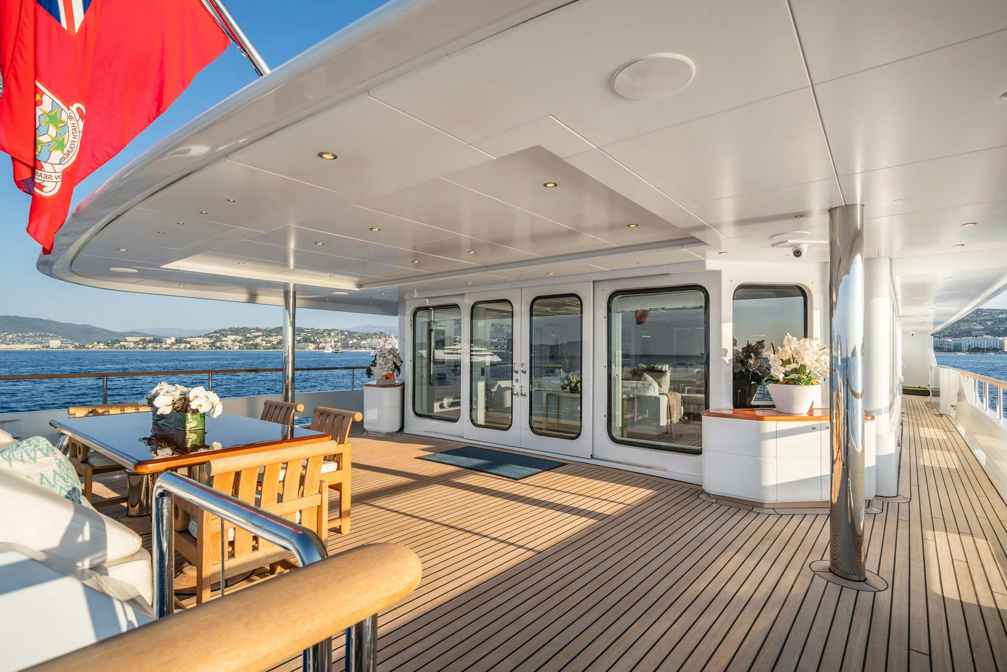 a room with a table and chairs aboard MOSAIQUE Yacht for Charter