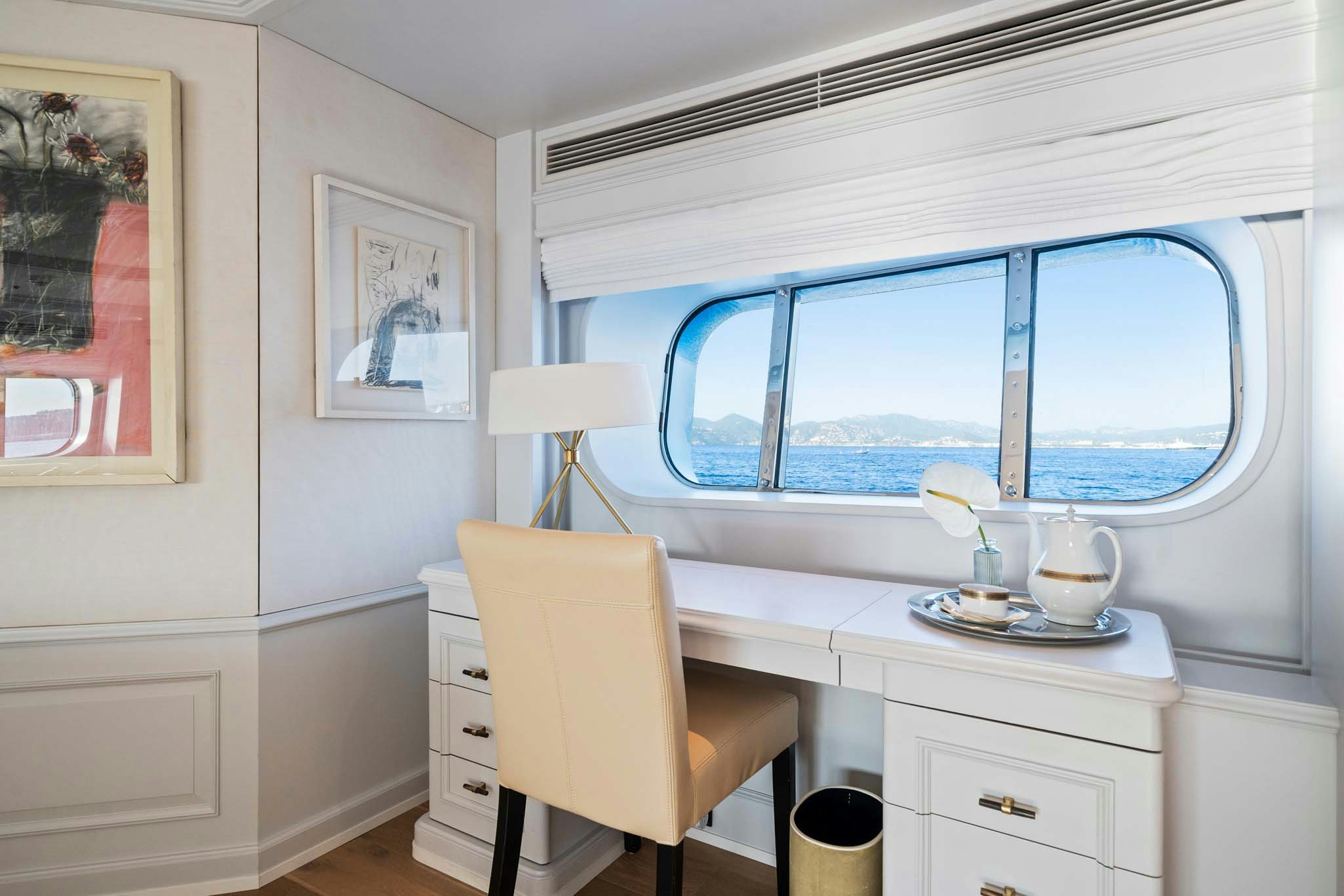 a room with a window and a desk aboard MOSAIQUE Yacht for Charter
