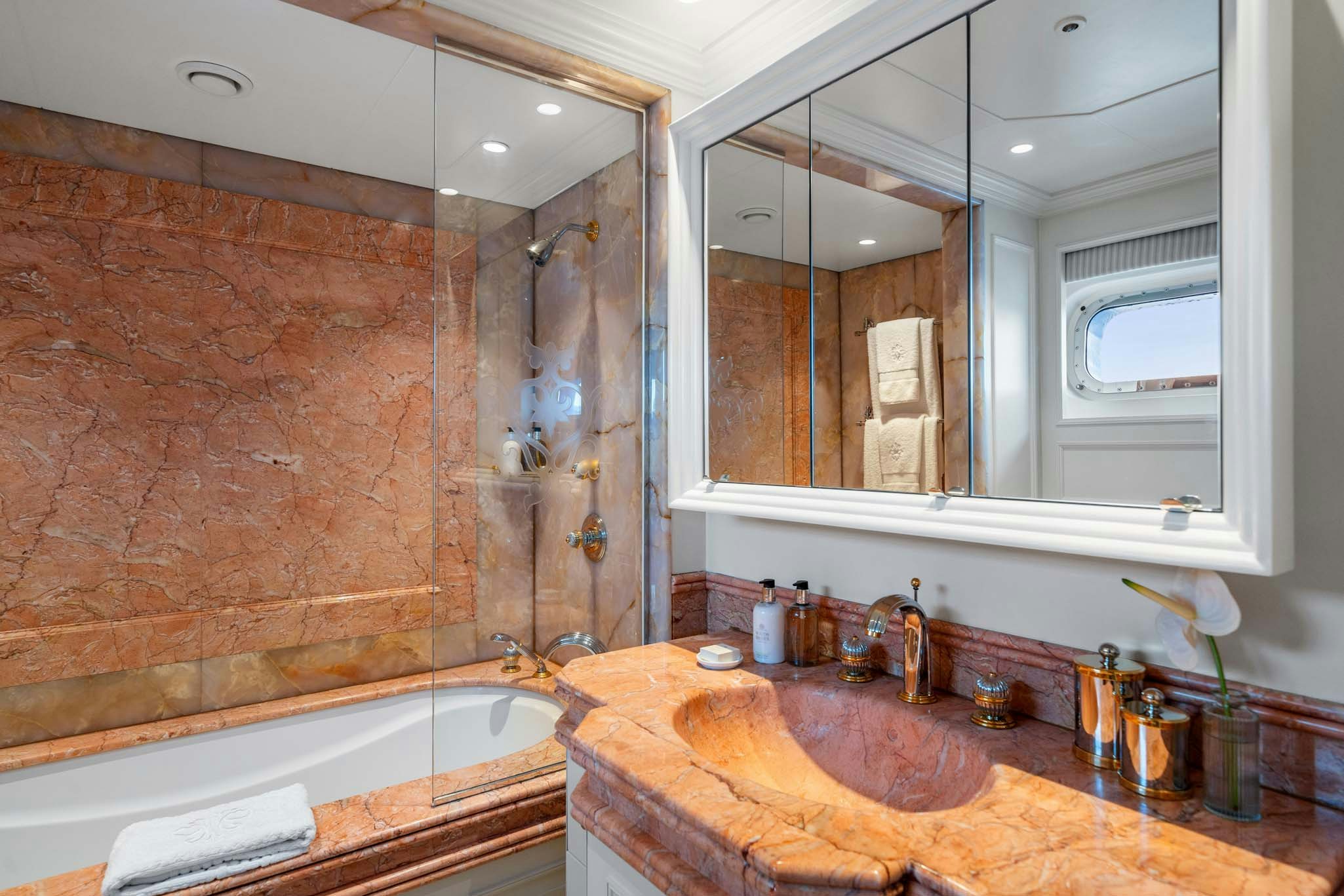 a bathroom with a large mirror aboard MOSAIQUE Yacht for Charter