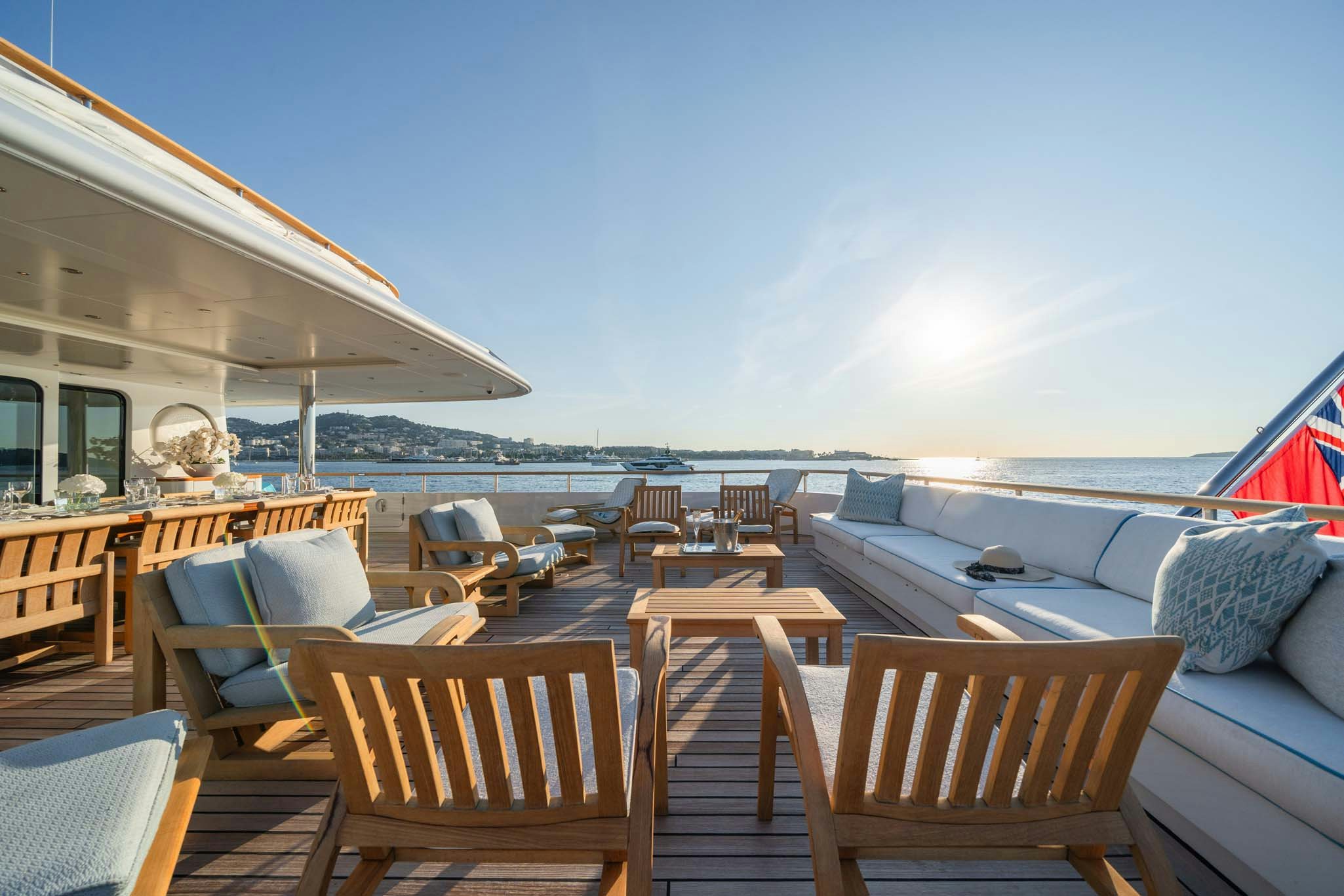 a deck with chairs and tables on it aboard MOSAIQUE Yacht for Charter