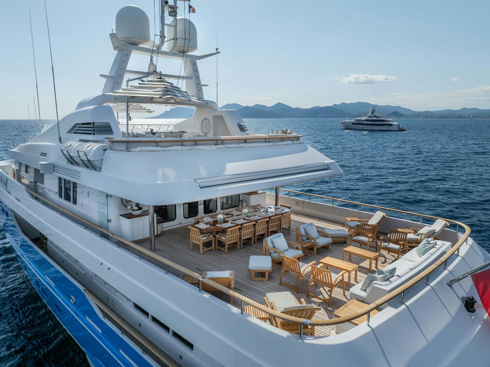 a large white boat on the water aboard MOSAIQUE Yacht for Charter