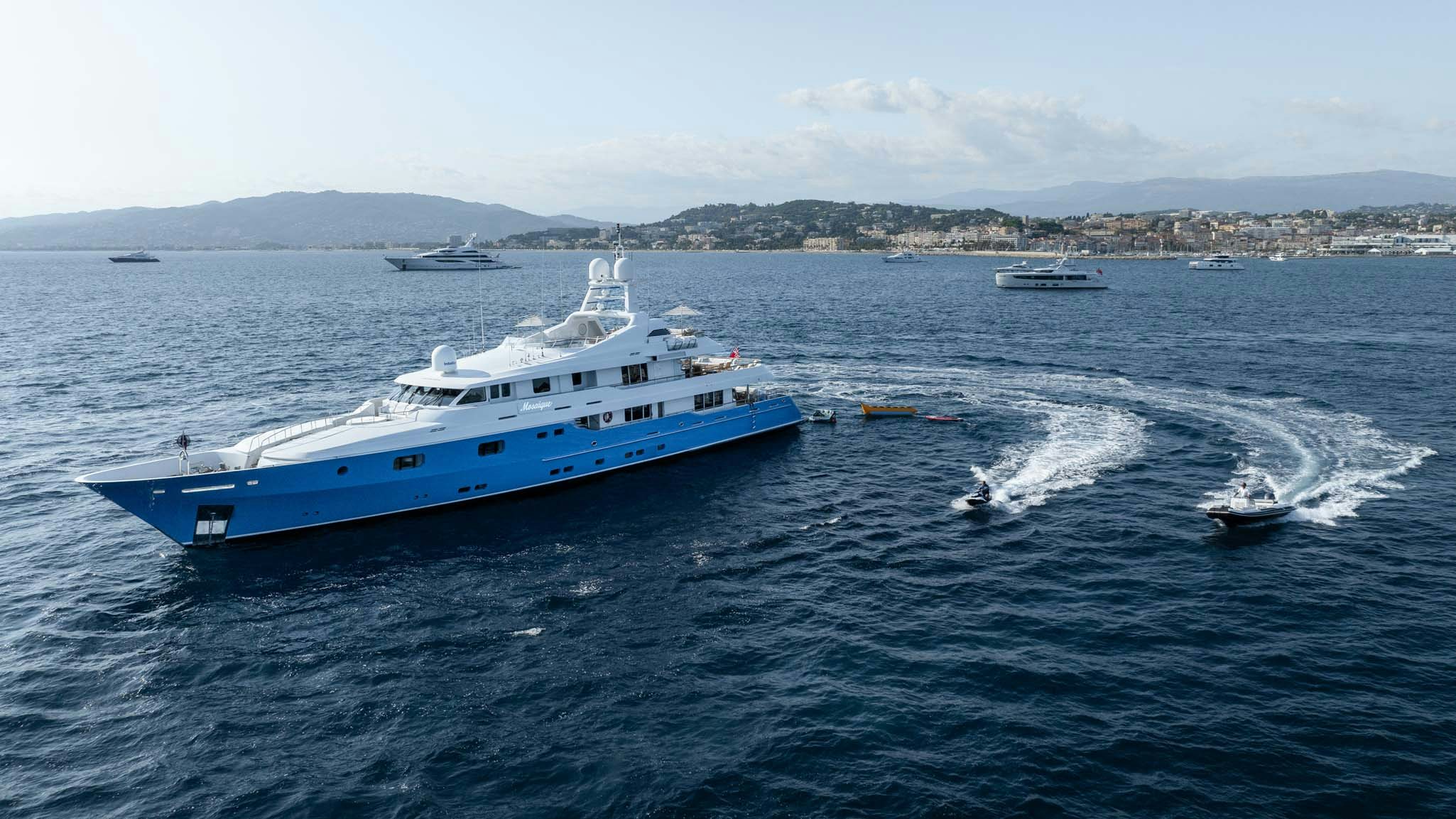 a large boat on the water aboard MOSAIQUE Yacht for Charter