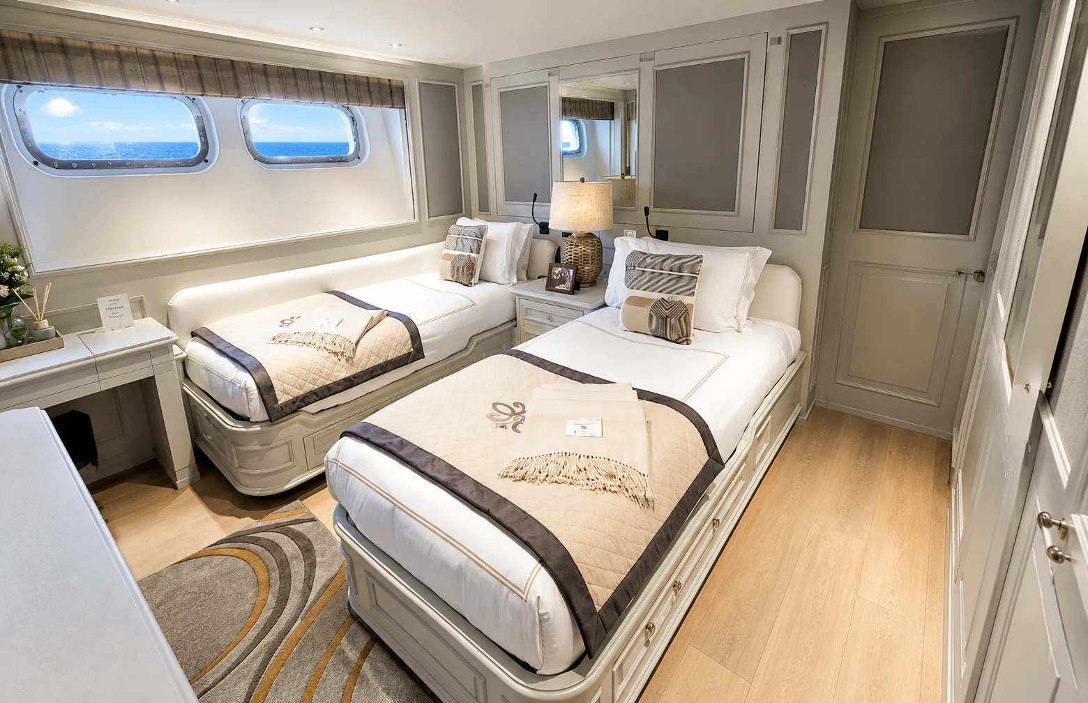a couple of beds in a room aboard MOSAIQUE Yacht for Charter