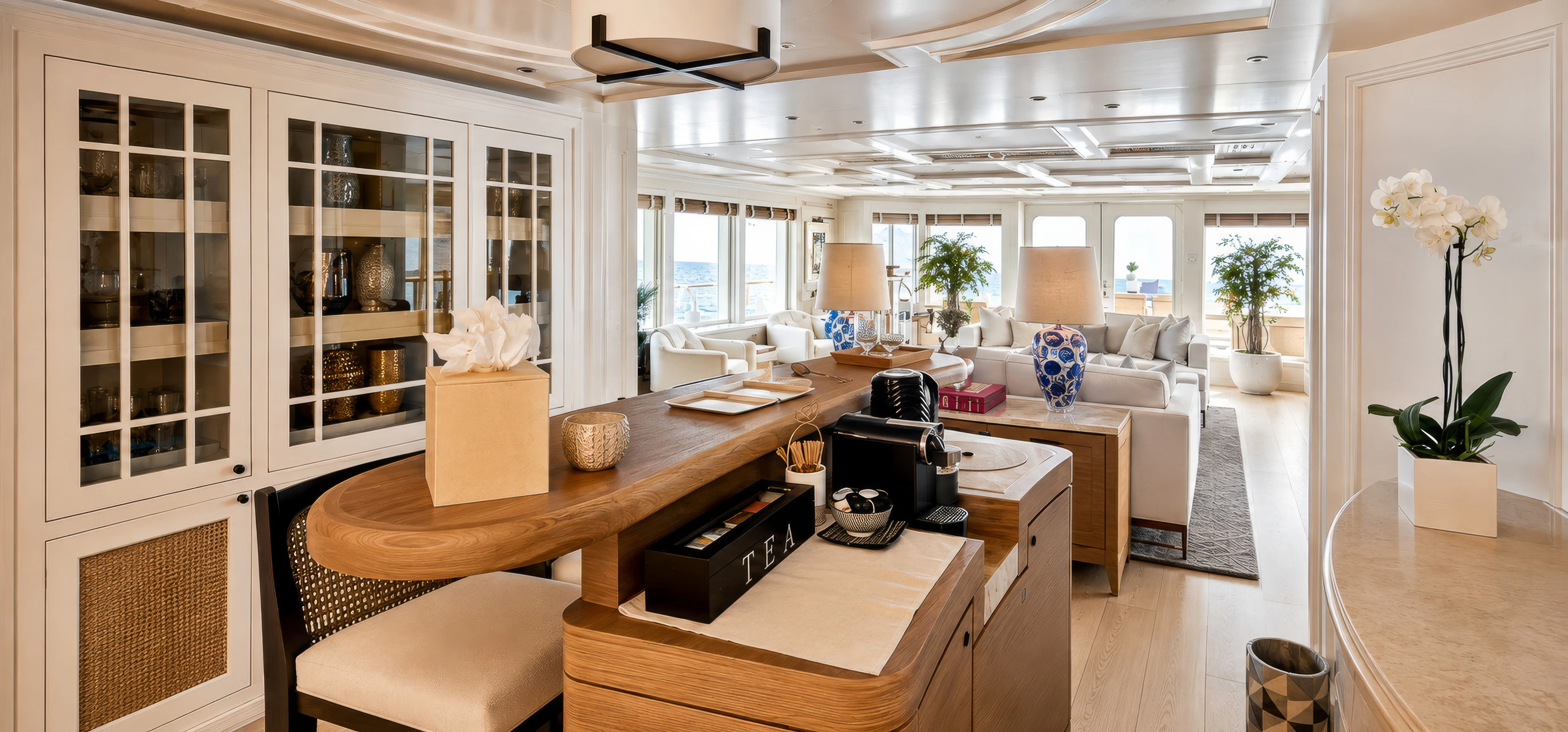 a living room with a table and chairs aboard MOSAIQUE Yacht for Charter