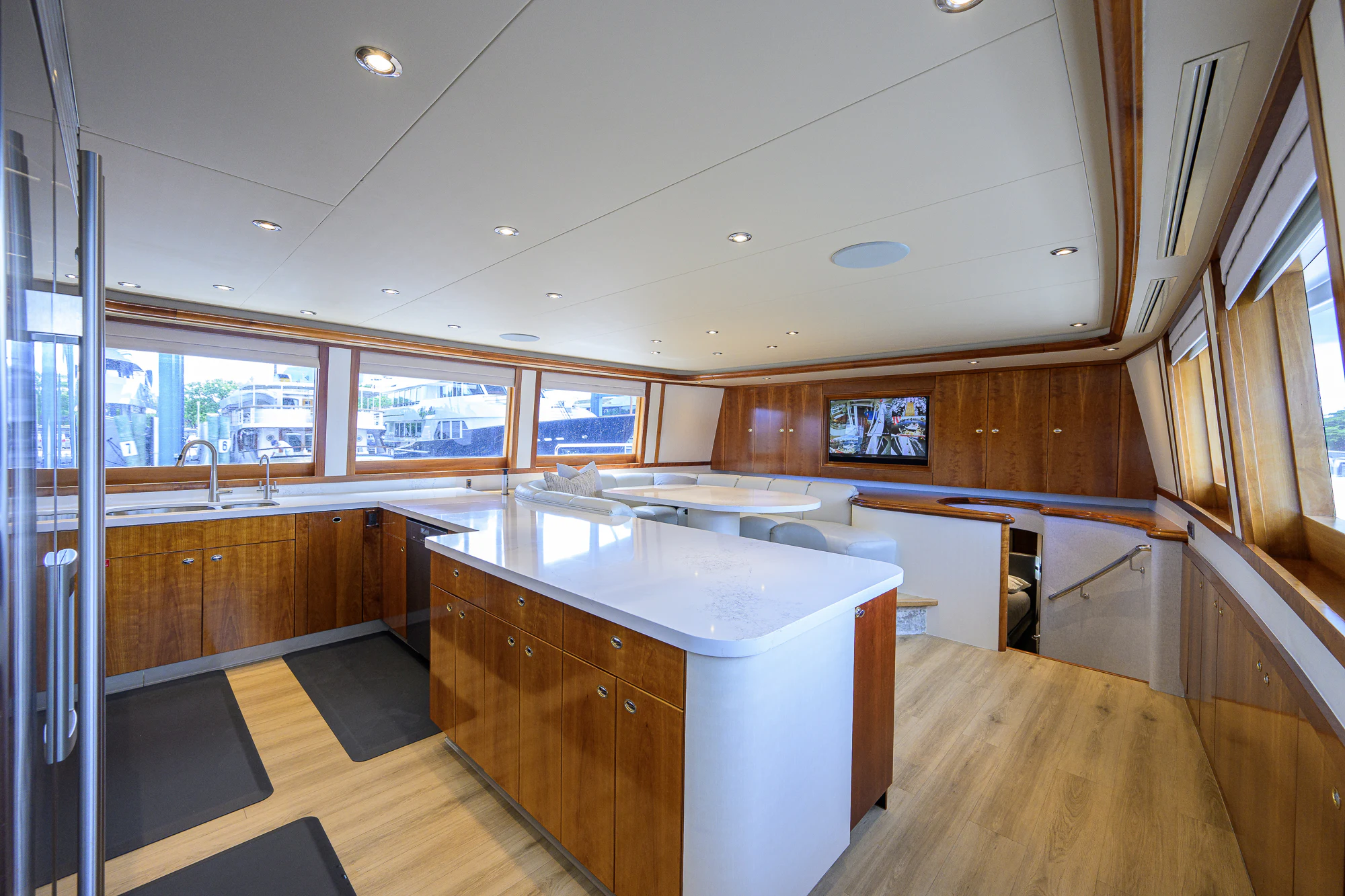 a large kitchen with wooden cabinets aboard BREEZY DAY Yacht for Sale