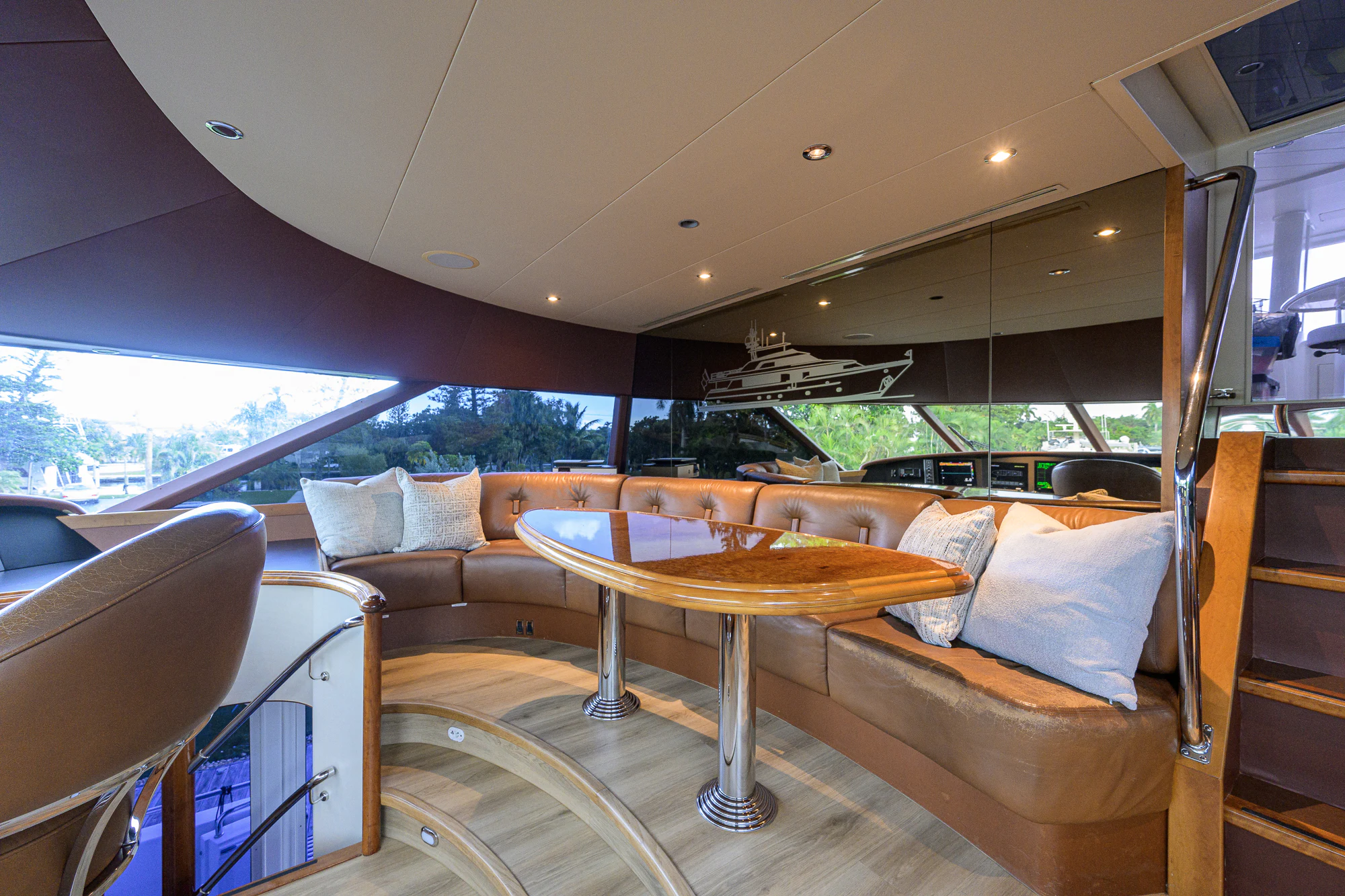 a living room with a table and couches aboard BREEZY DAY Yacht for Sale
