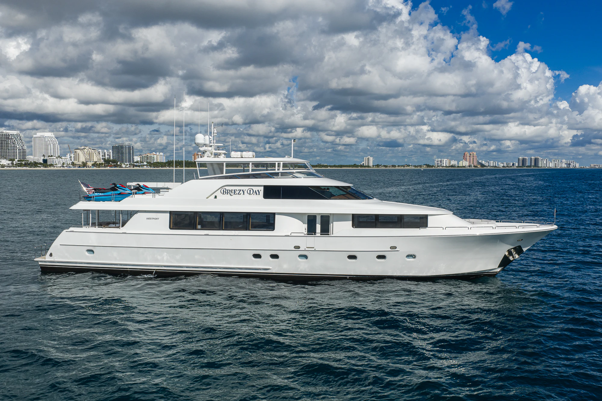 a white boat in the water aboard BREEZY DAY Yacht for Sale