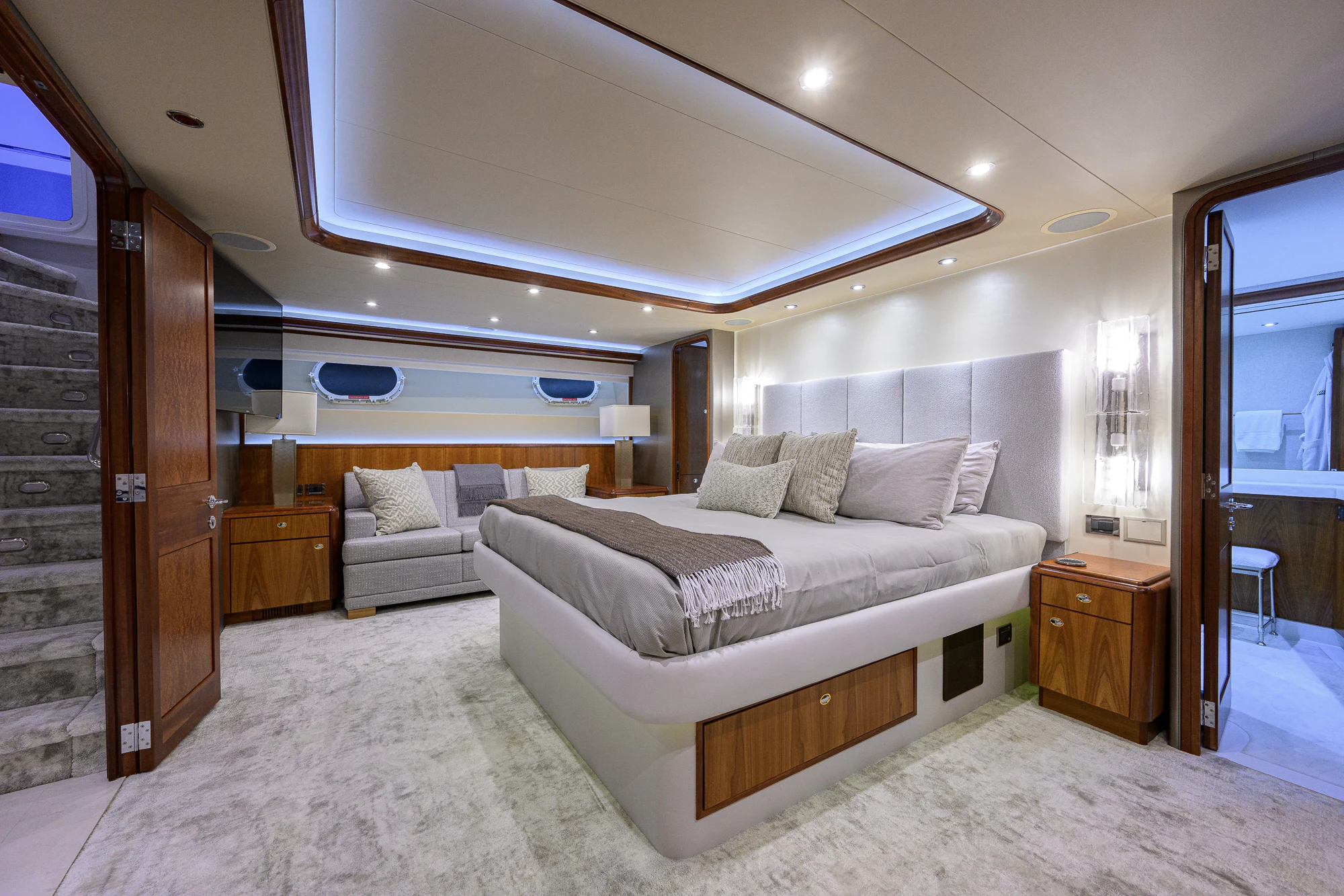 a bedroom with a bed and a couch aboard BREEZY DAY Yacht for Sale