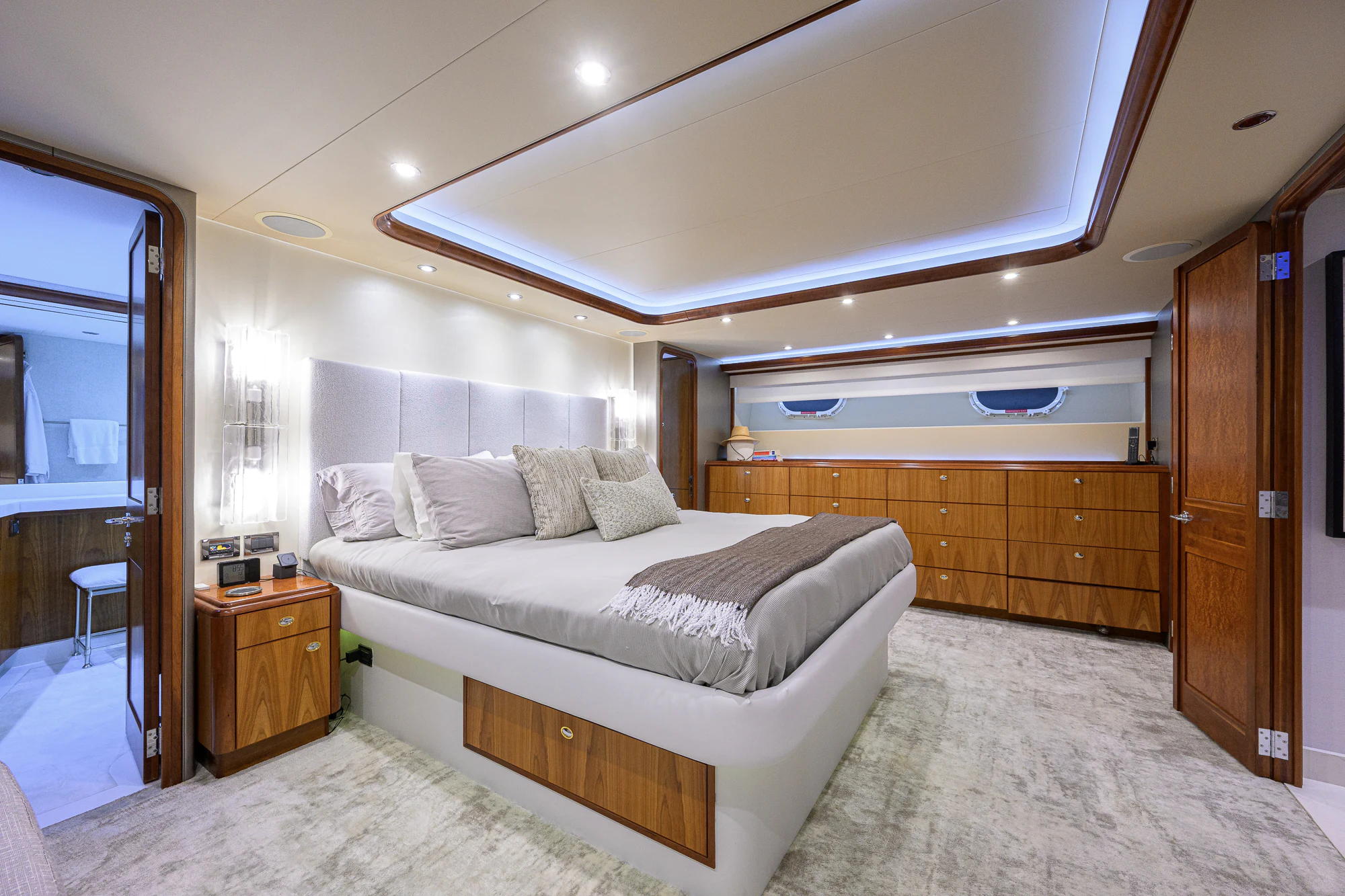 a bedroom with a bed and a dresser aboard BREEZY DAY Yacht for Sale