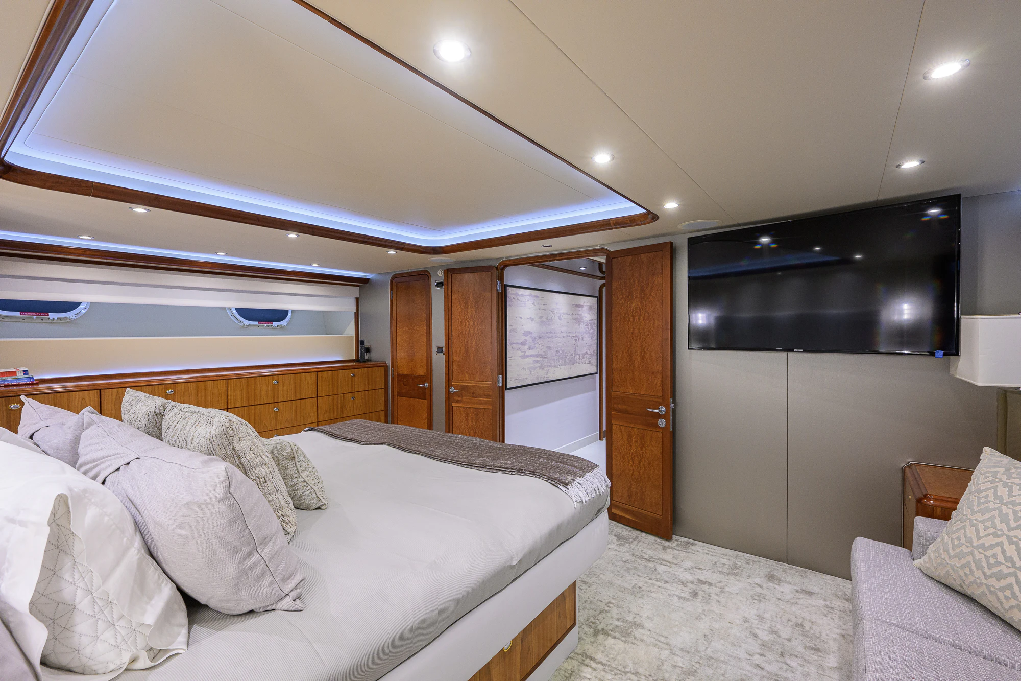 a bedroom with a bed and a closet aboard BREEZY DAY Yacht for Sale