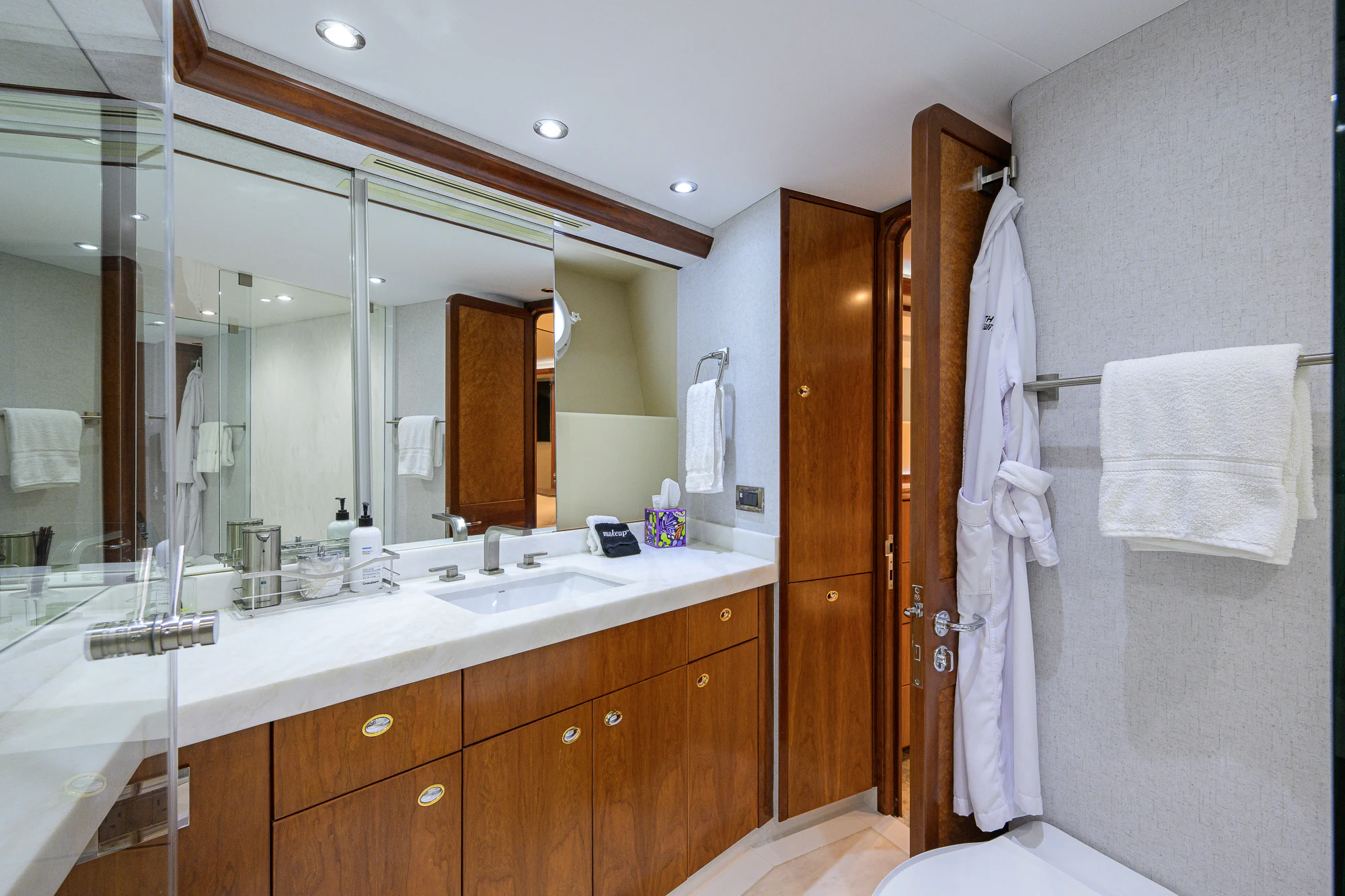 a bathroom with a sink and a mirror aboard BREEZY DAY Yacht for Sale