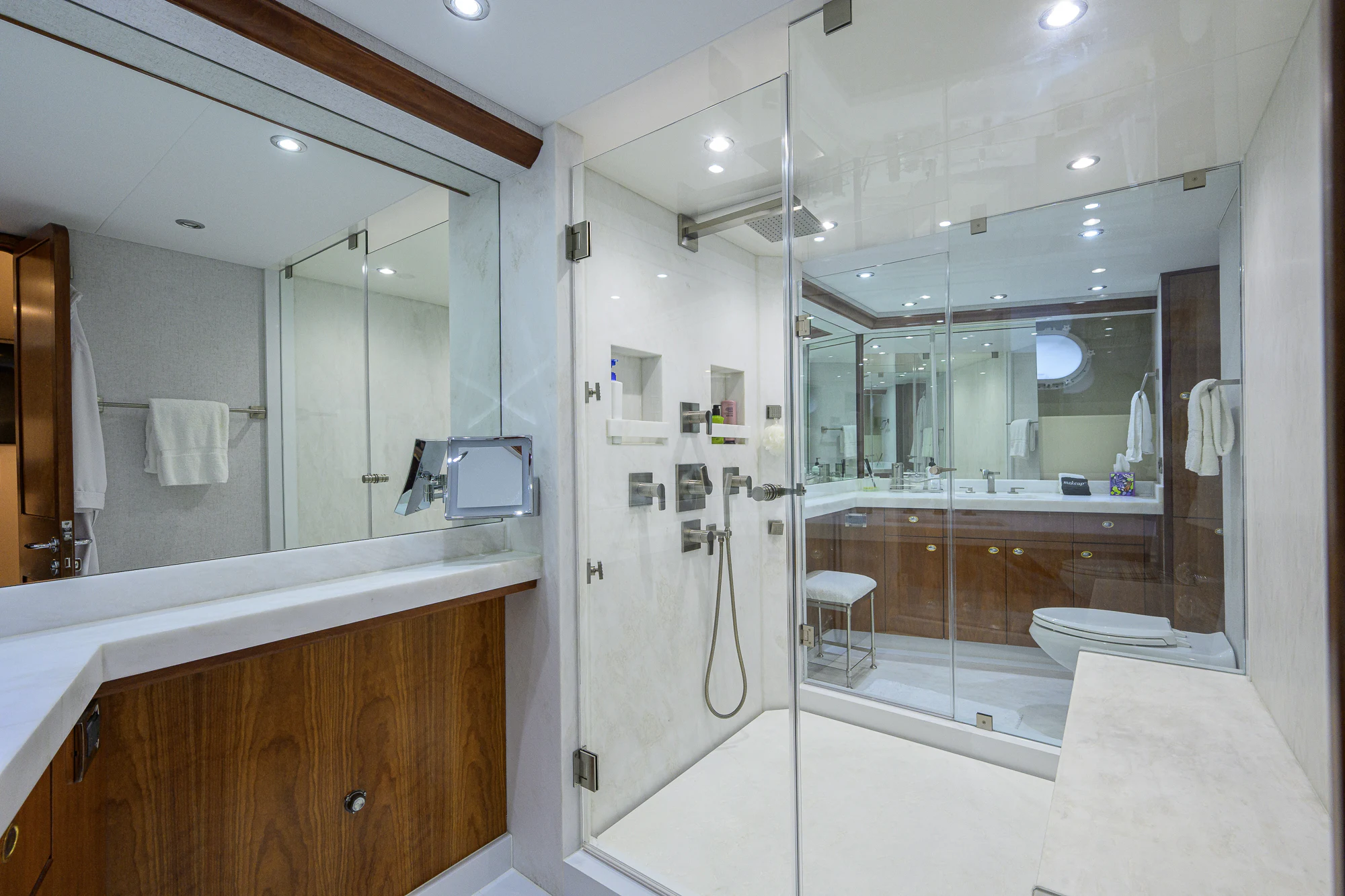 a bathroom with a large mirror aboard BREEZY DAY Yacht for Sale