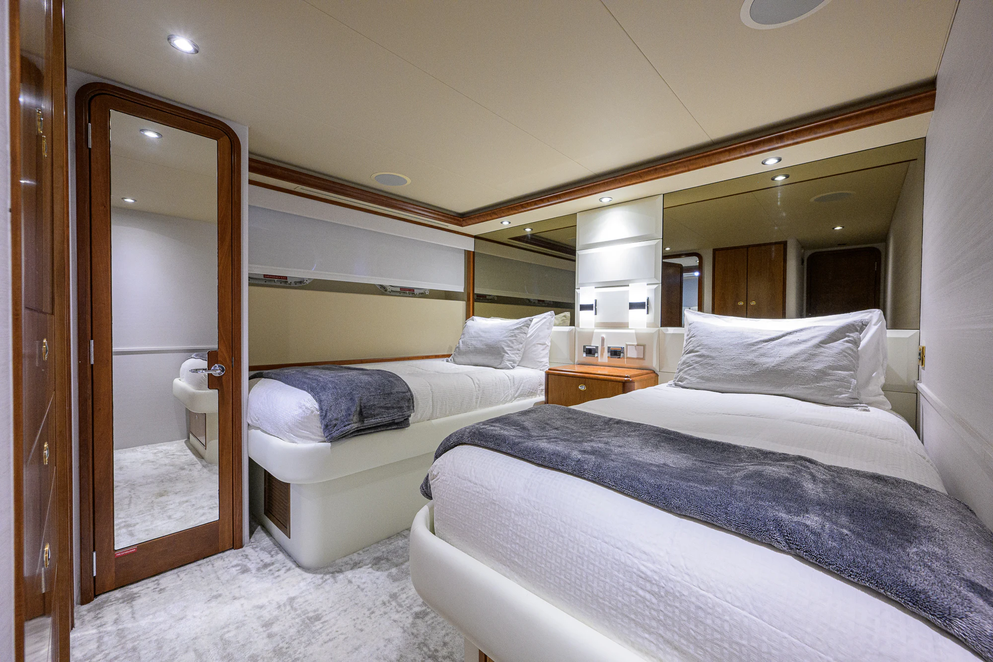 a room with a couple of beds aboard BREEZY DAY Yacht for Sale