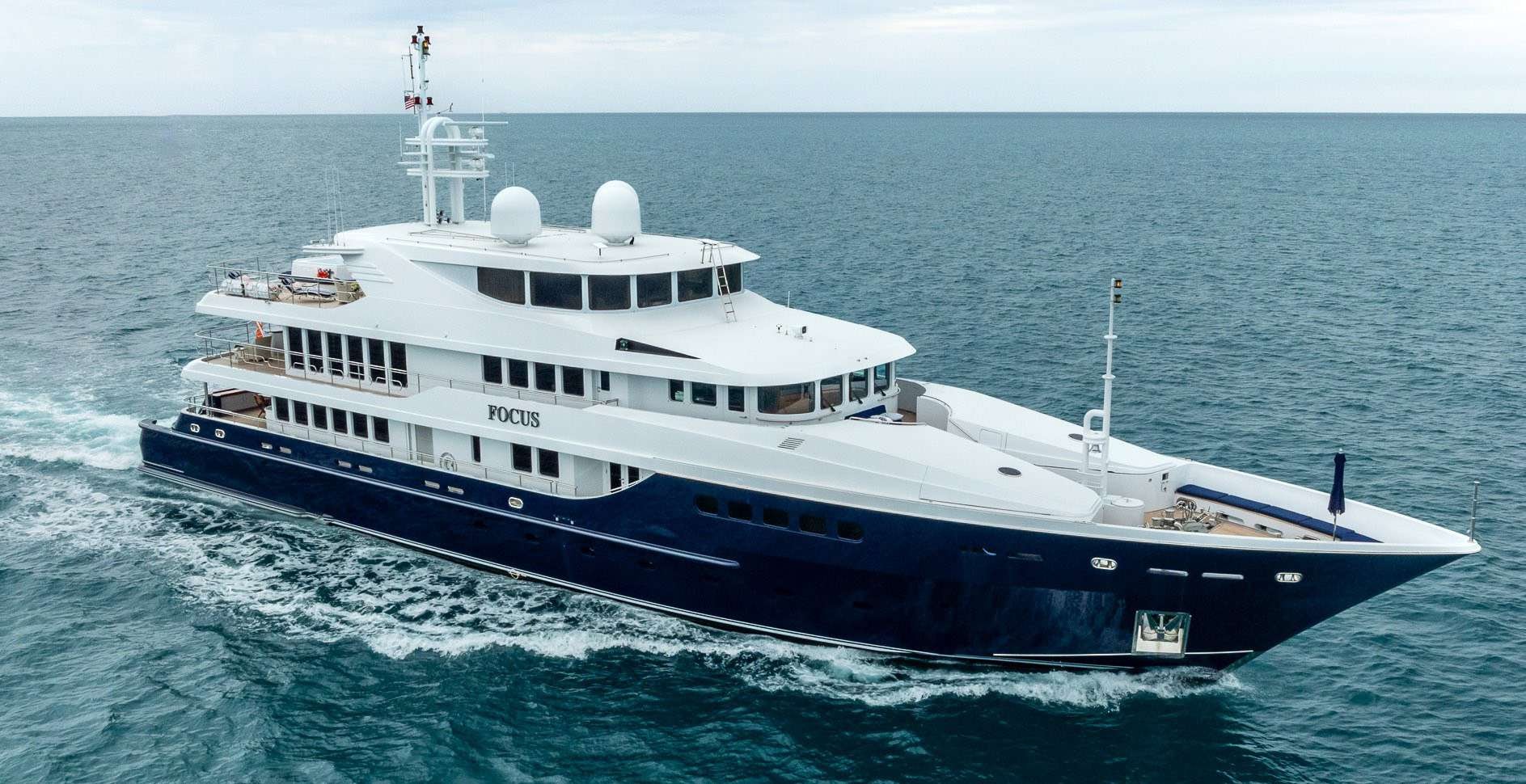 a large white ship in the water aboard FOCUS Yacht for Sale