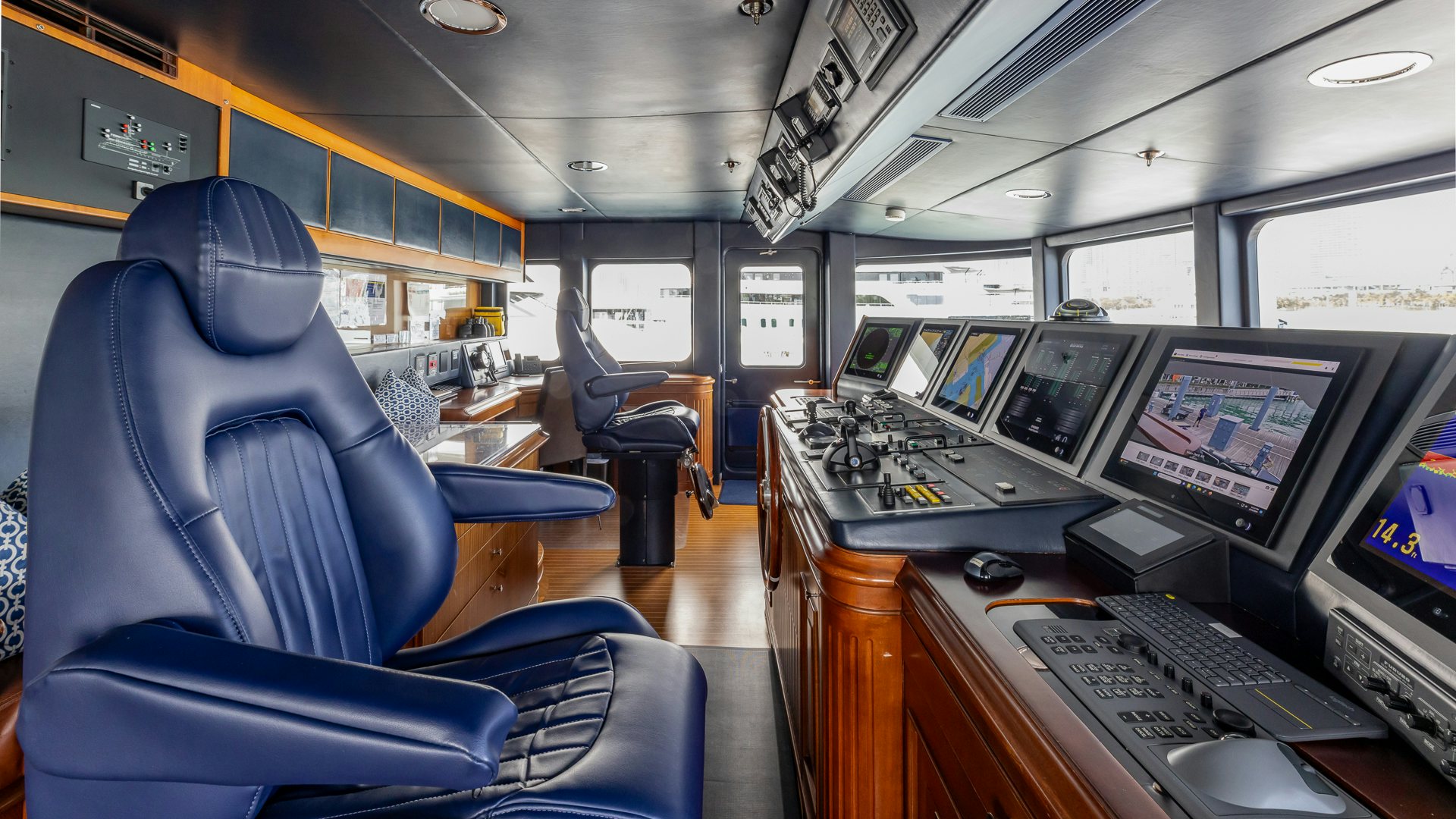 a room with computers and monitors aboard FOCUS Yacht for Sale