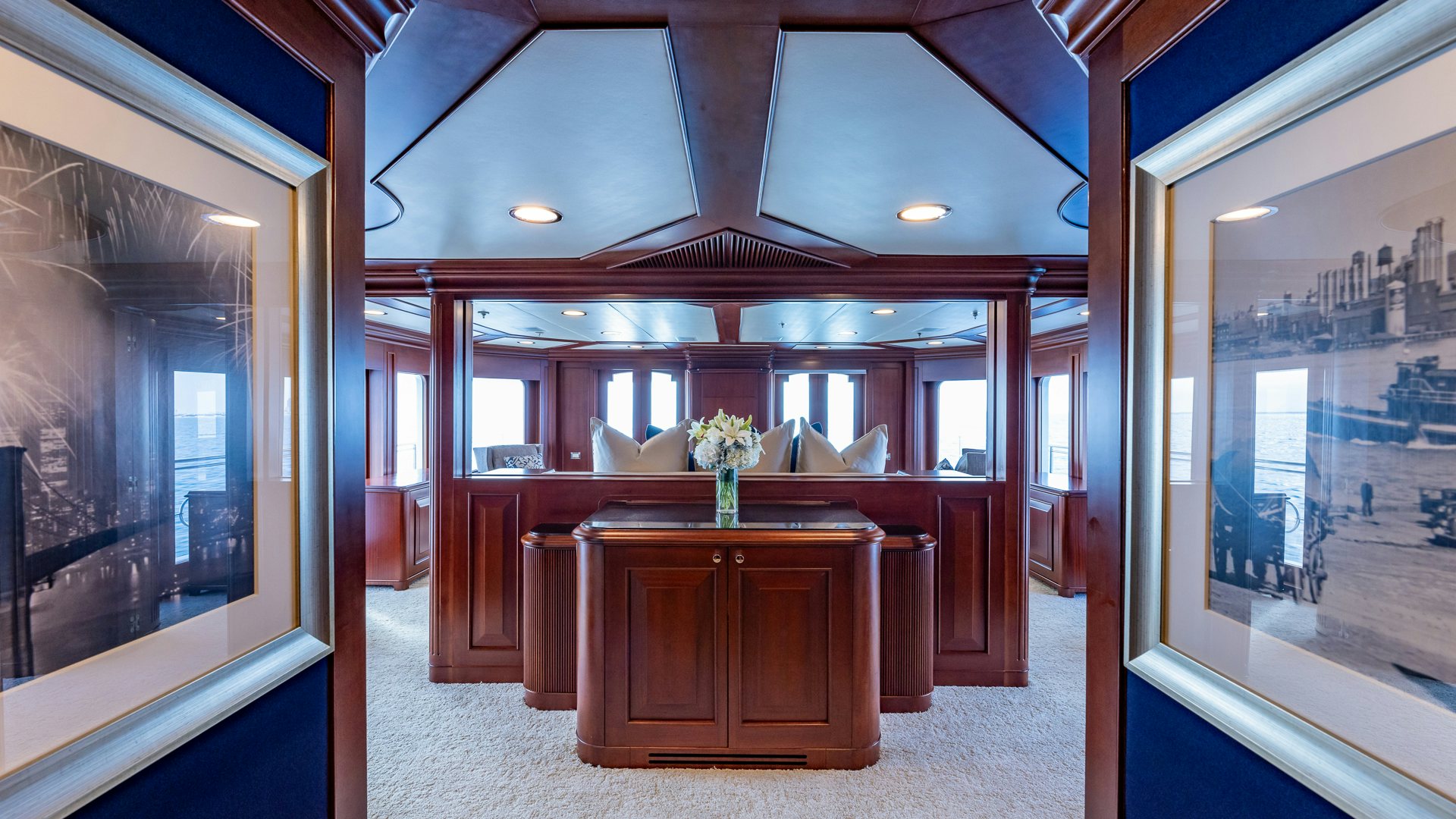 a room with a table and chairs aboard FOCUS Yacht for Sale