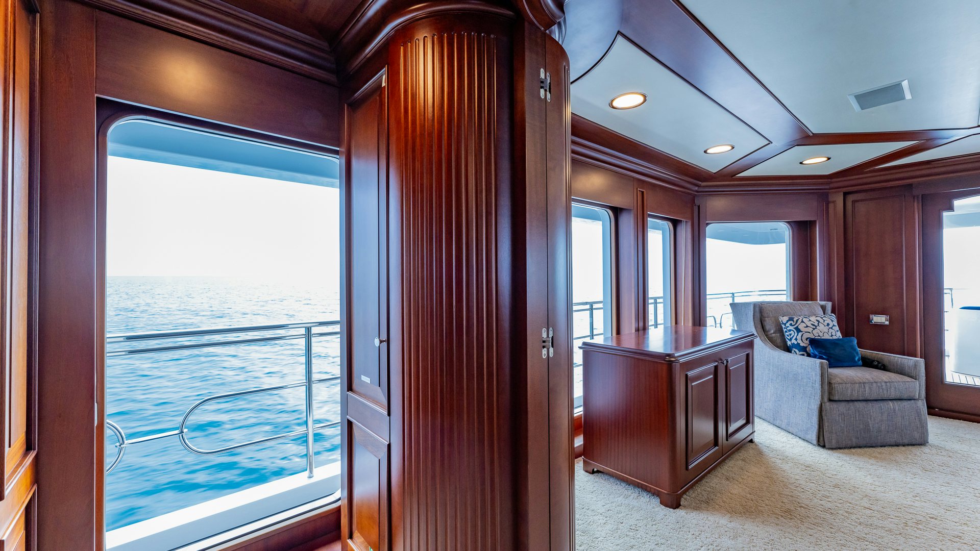 a living room with a large sliding door aboard FOCUS Yacht for Sale
