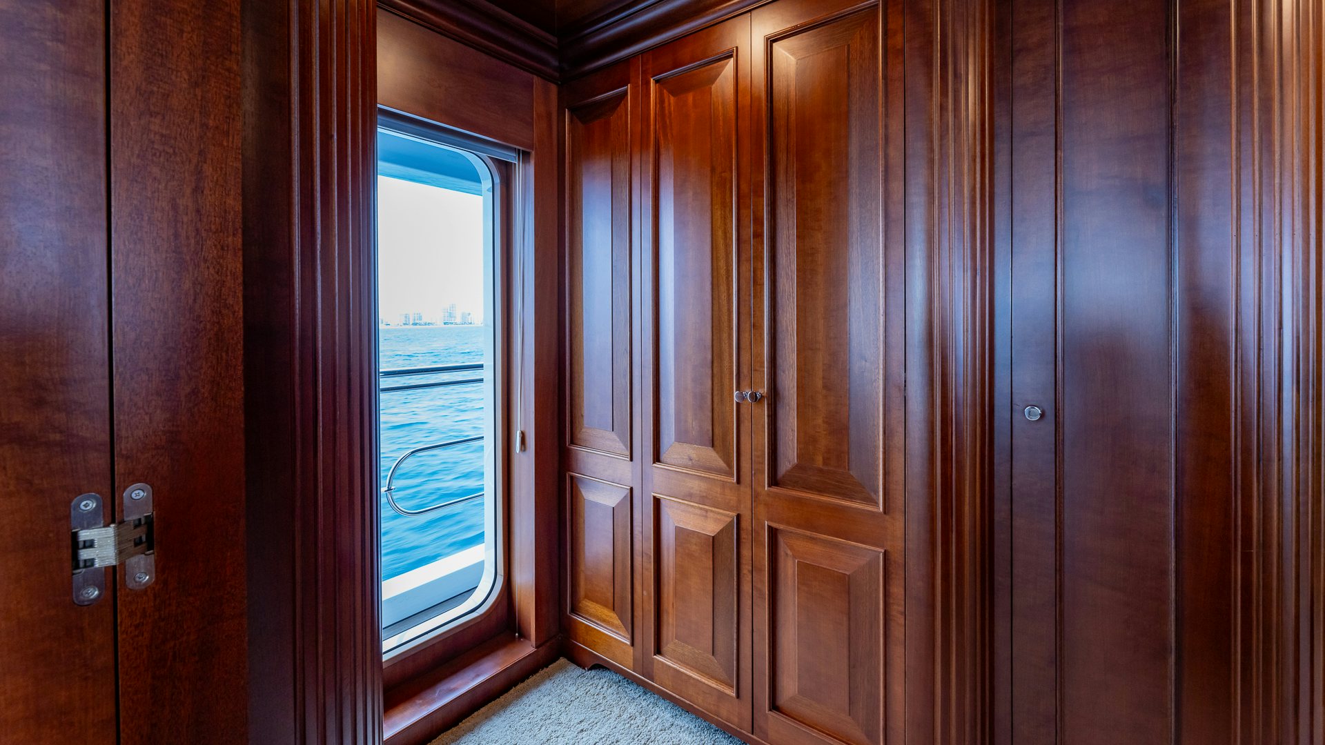 a room with wooden cabinets aboard FOCUS Yacht for Sale