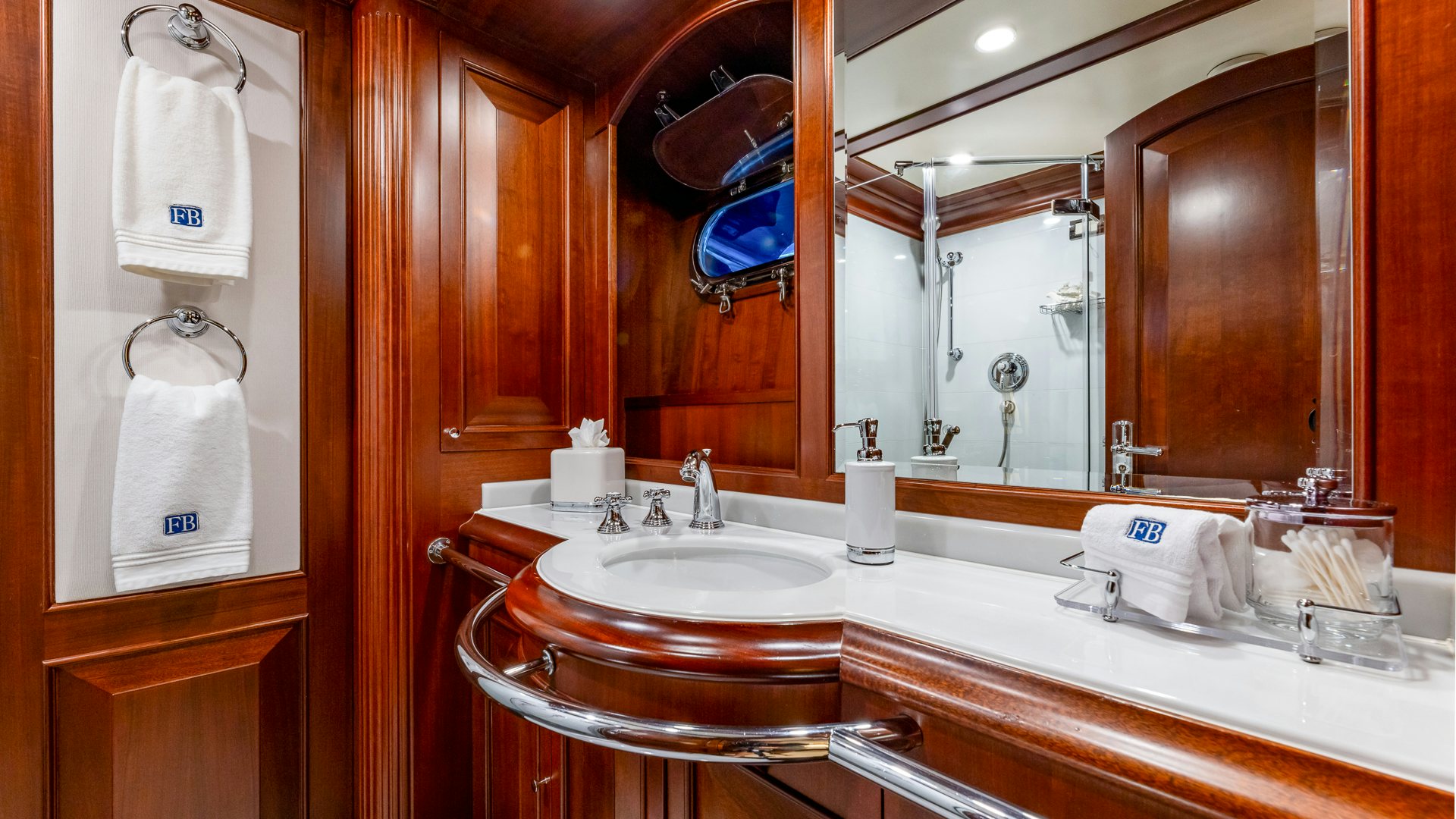 a bathroom with a large mirror aboard FOCUS Yacht for Sale