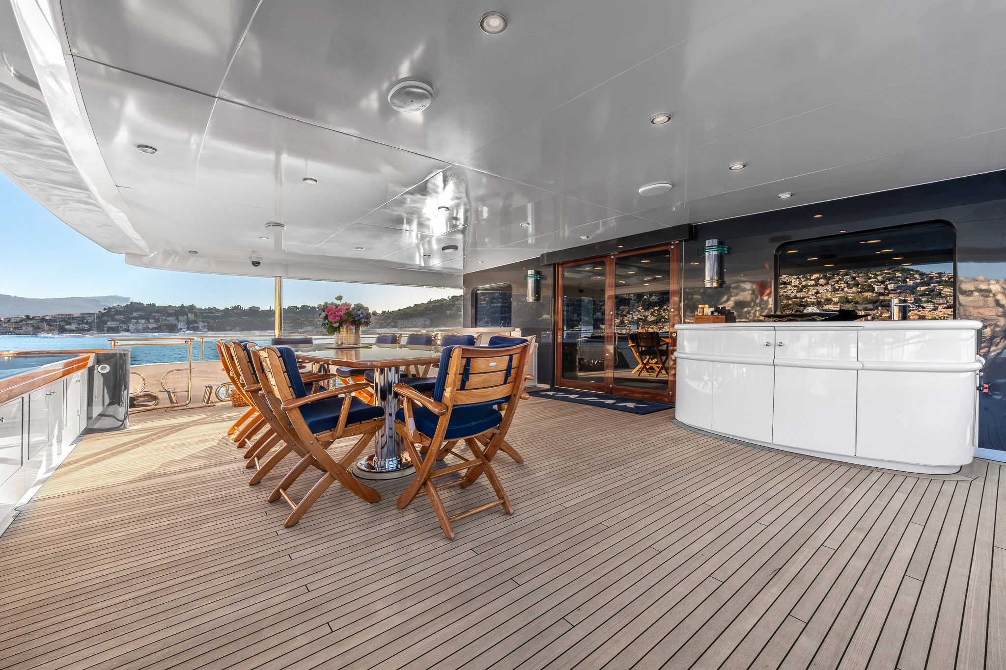 a room with a table and chairs aboard KAJAK Yacht for Sale