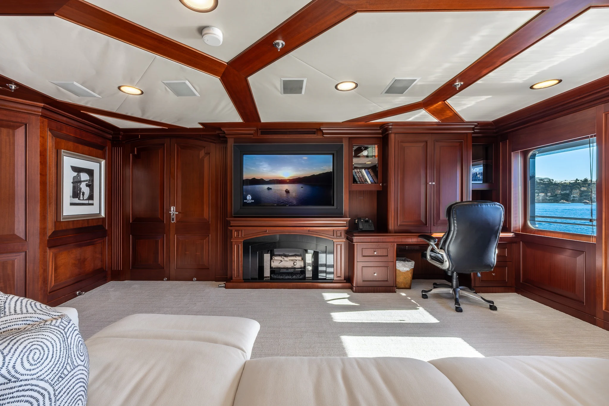 a room with a tv and a bed aboard KAJAK Yacht for Sale