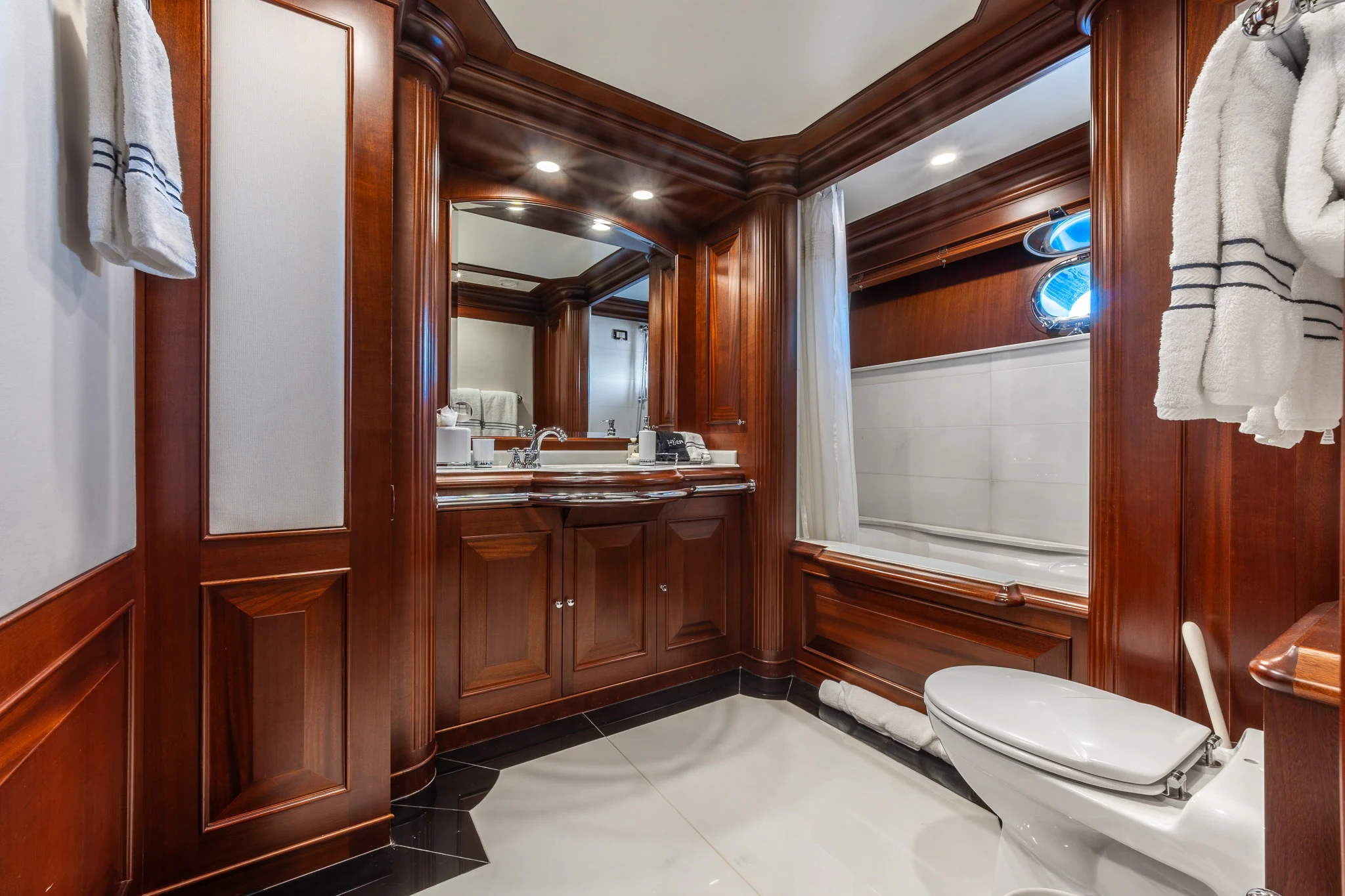 a bathroom with a toilet and a sink aboard KAJAK Yacht for Sale