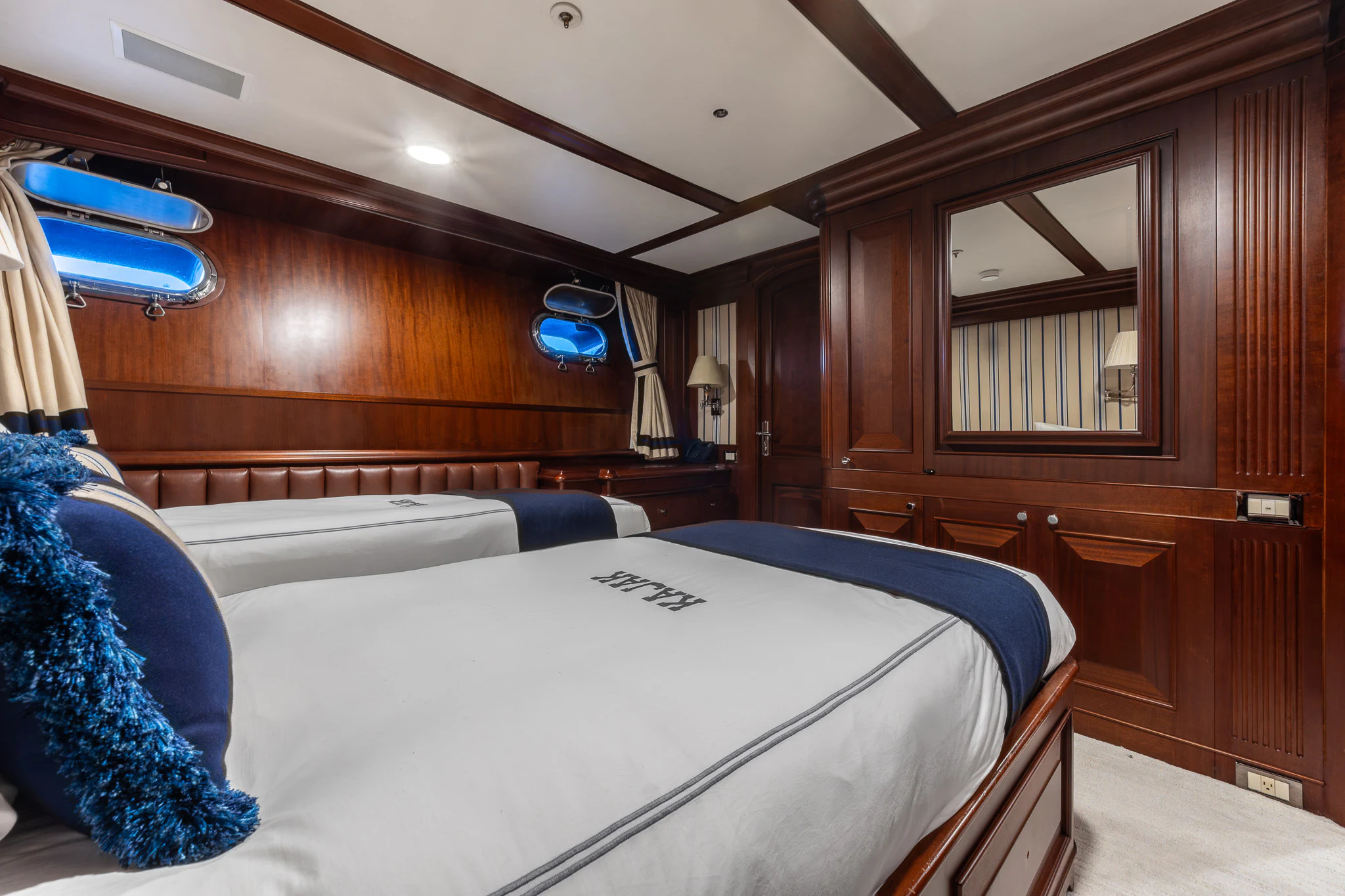 a bed in a room aboard KAJAK Yacht for Sale