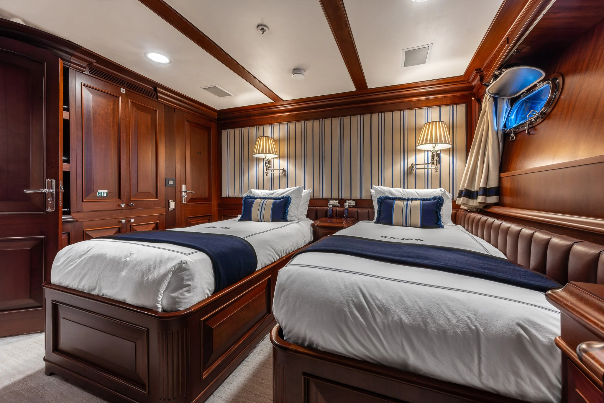 a couple of beds in a room aboard KAJAK Yacht for Sale