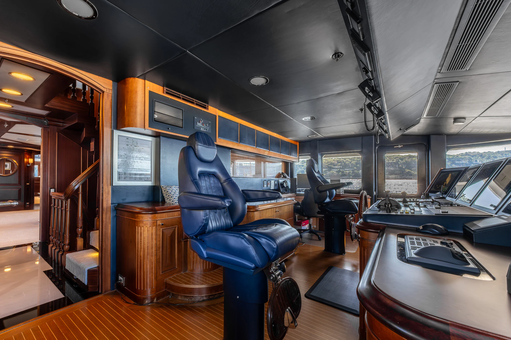 a room with a desk and chairs aboard KAJAK Yacht for Sale