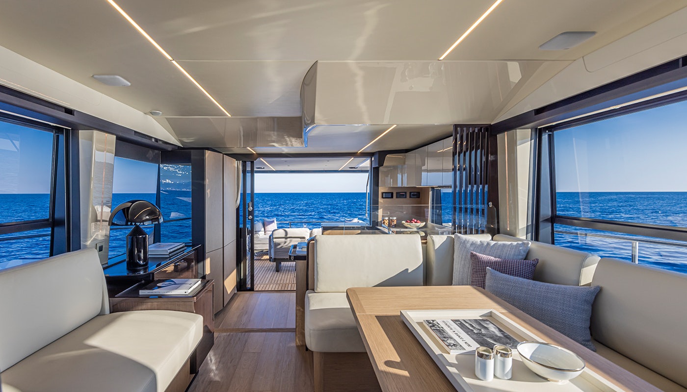 a living room with a large window aboard ABSOLUTE 56 FLYBRIDGE Yacht for Sale