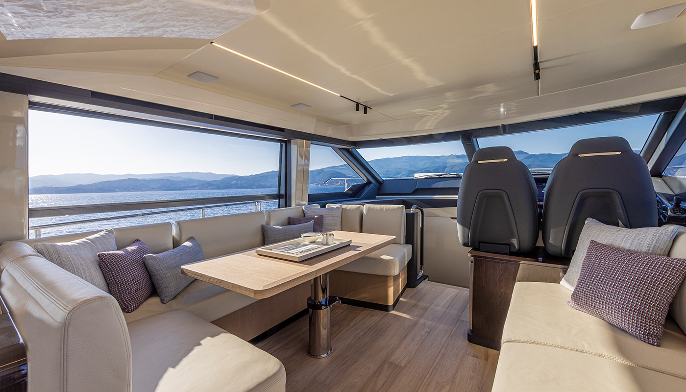 a boat with a table and chairs aboard ABSOLUTE 56 FLYBRIDGE Yacht for Sale