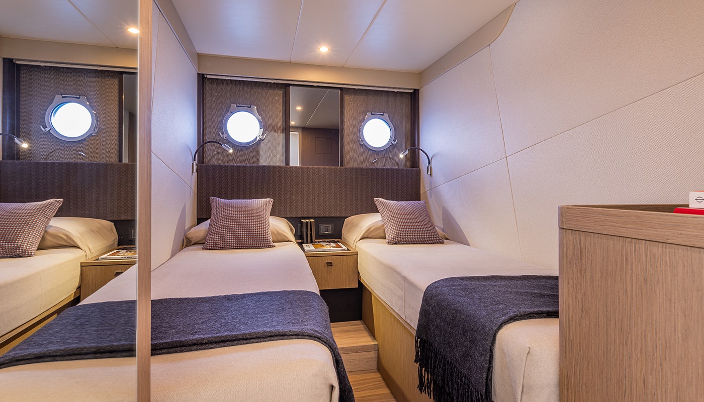 a room with two beds aboard ABSOLUTE 56 FLYBRIDGE Yacht for Sale