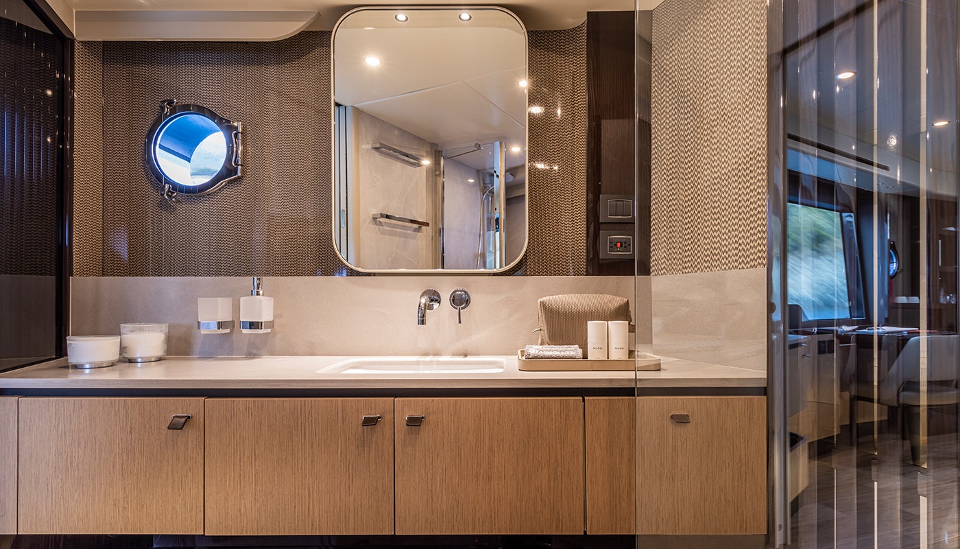a bathroom with a large mirror aboard ABSOLUTE 56 FLYBRIDGE Yacht for Sale