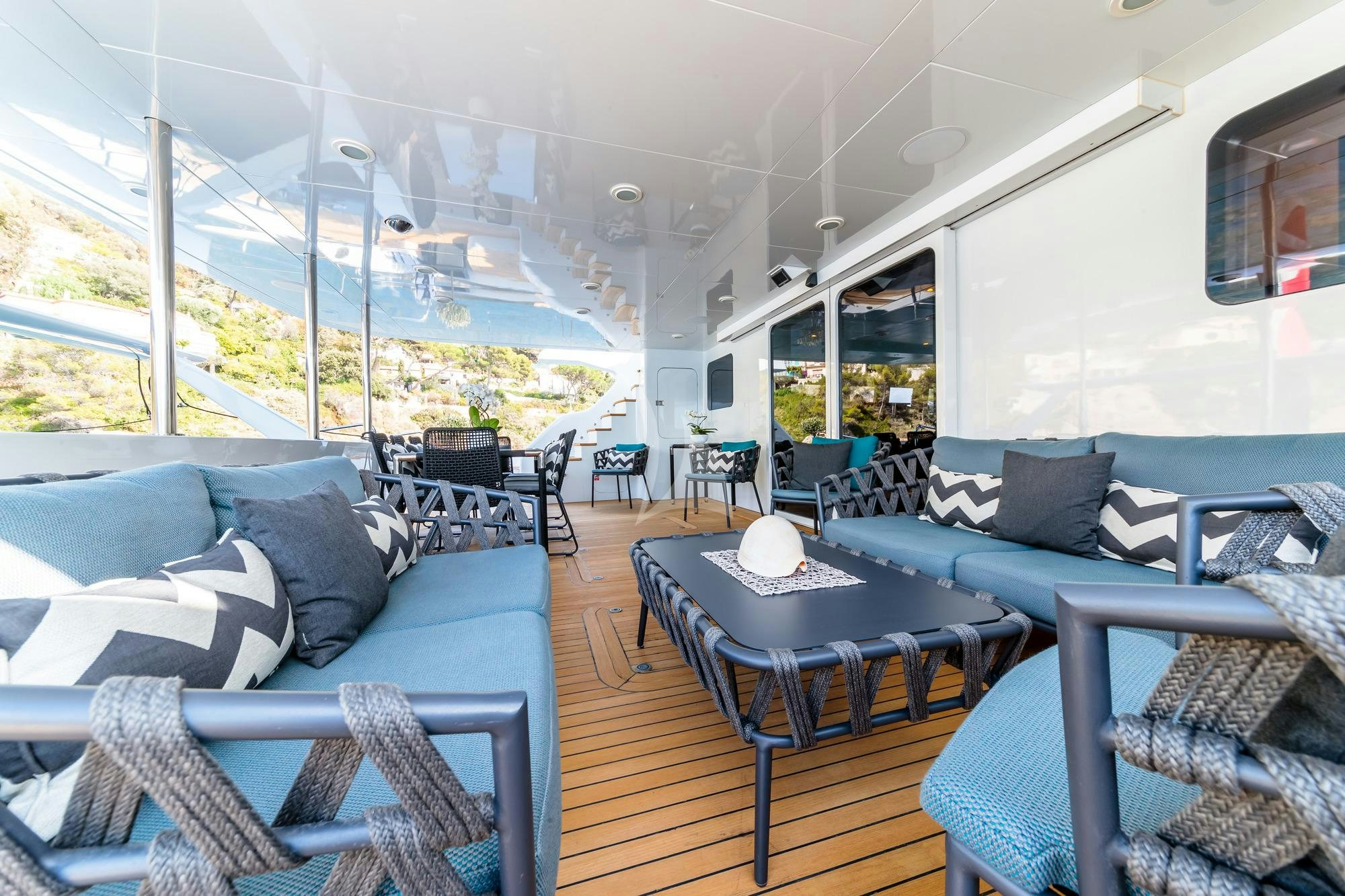 a living room with a large window aboard ALLURES Yacht for Charter