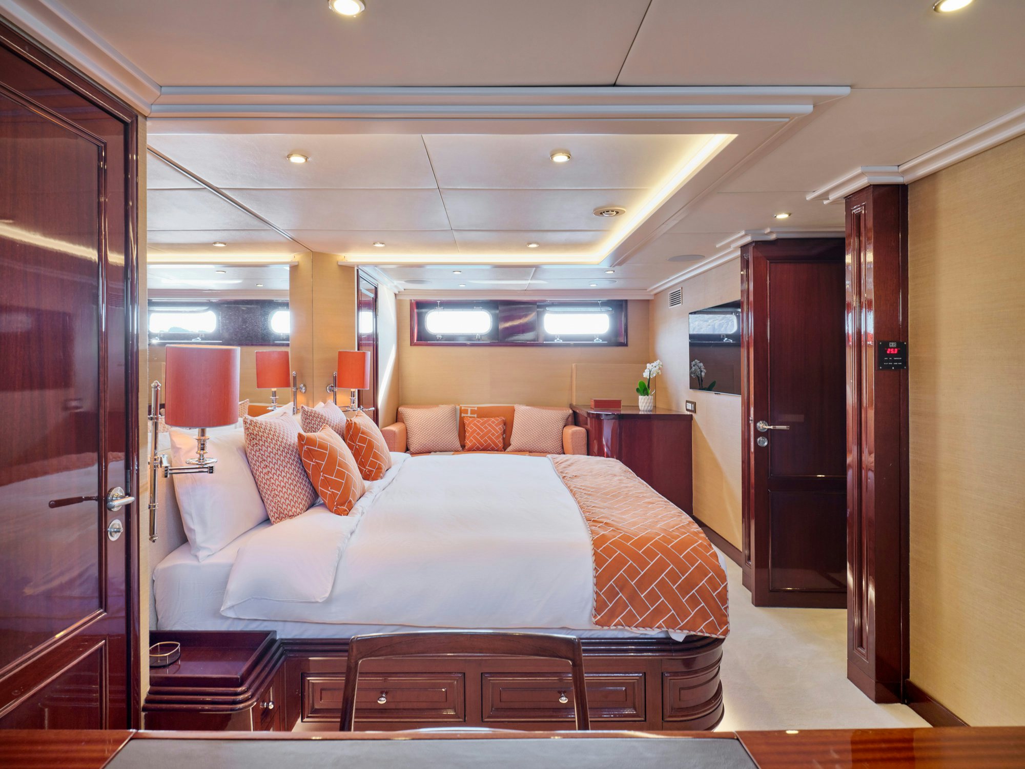 a bedroom with a bed and a desk aboard MIA ZOI Yacht for Charter