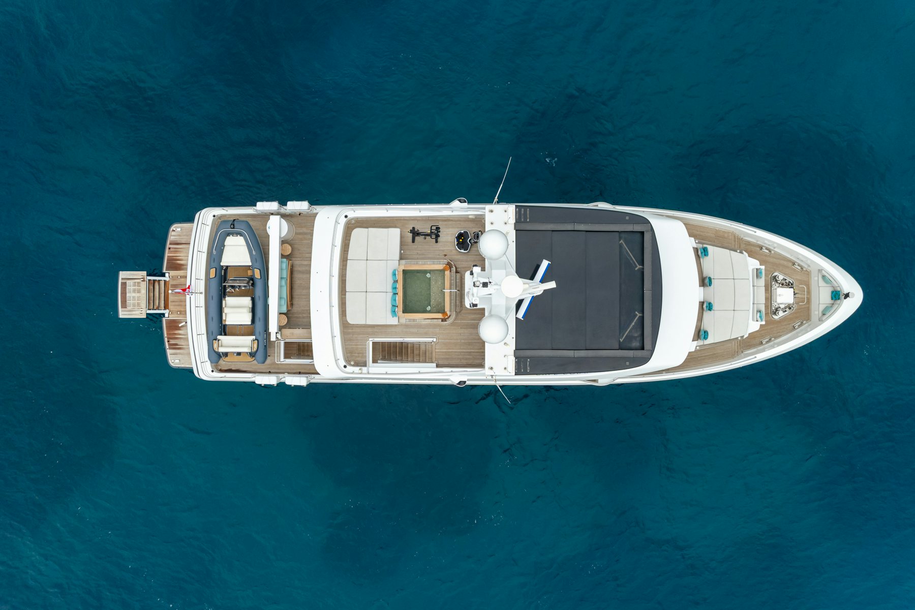 a white boat with a drone on it aboard CAPE COD II Yacht for Sale
