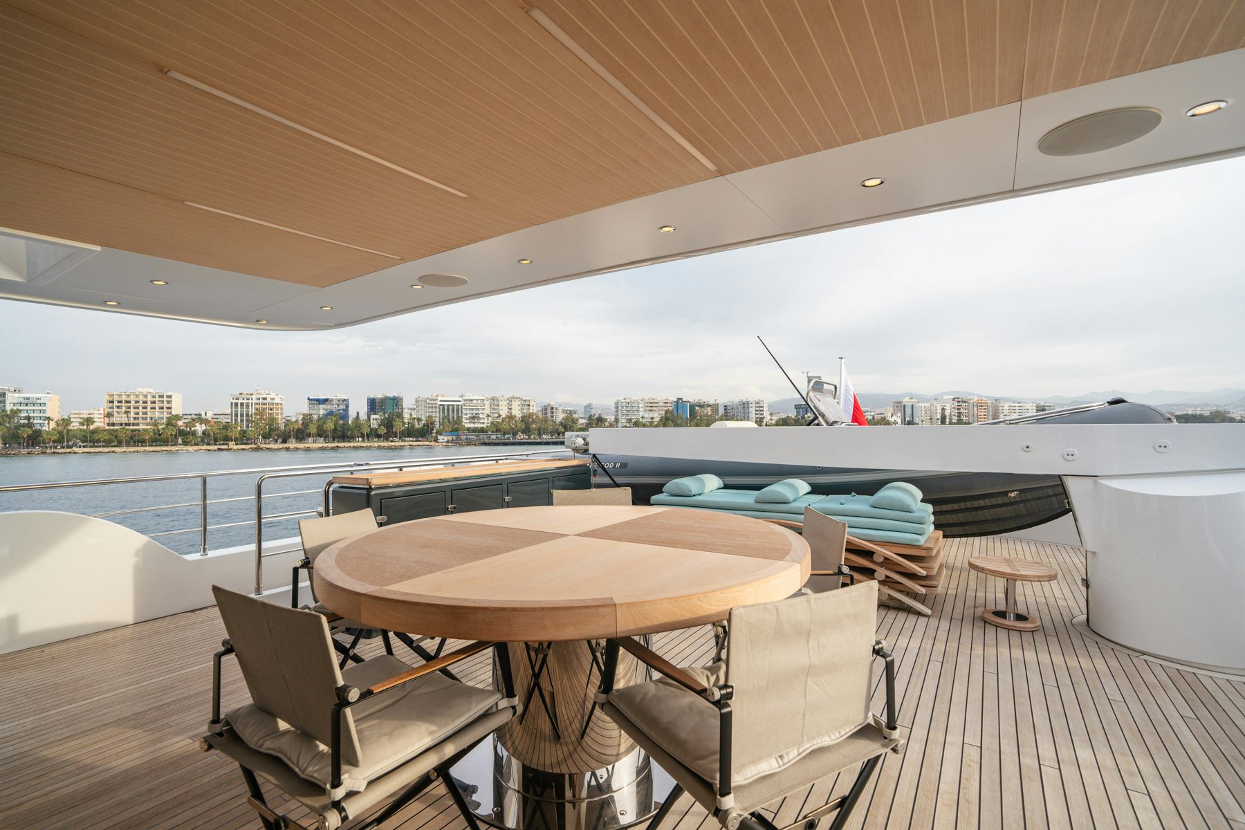 a table and chairs on a deck aboard CAPE COD II Yacht for Sale