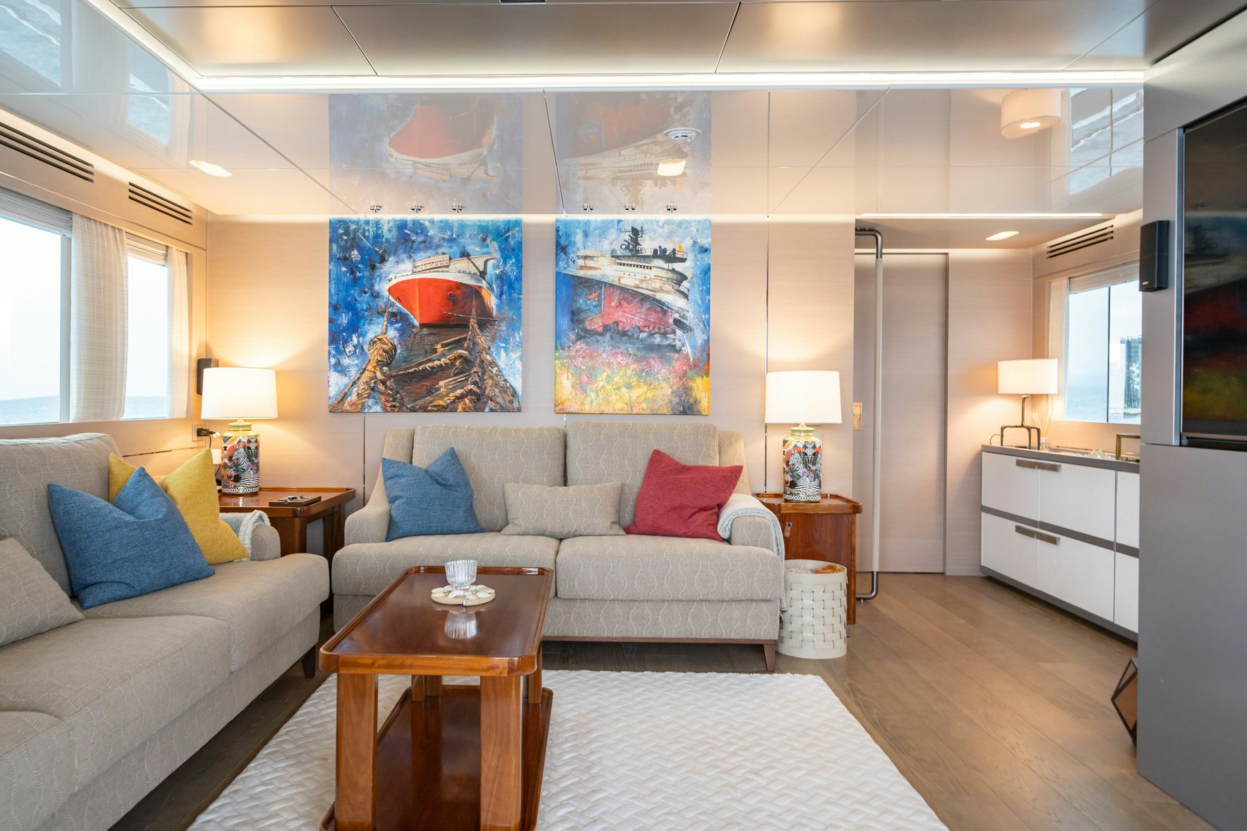 a living room with a couch and a table aboard CAPE COD II Yacht for Sale