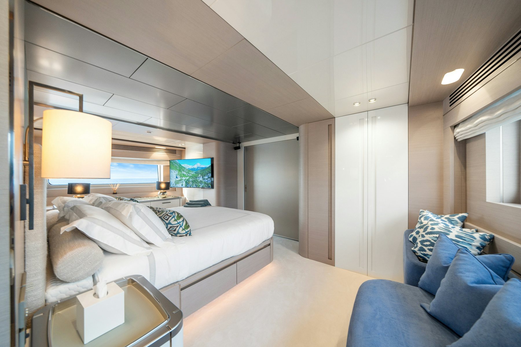 a bedroom with a bed and a desk aboard CAPE COD II Yacht for Sale