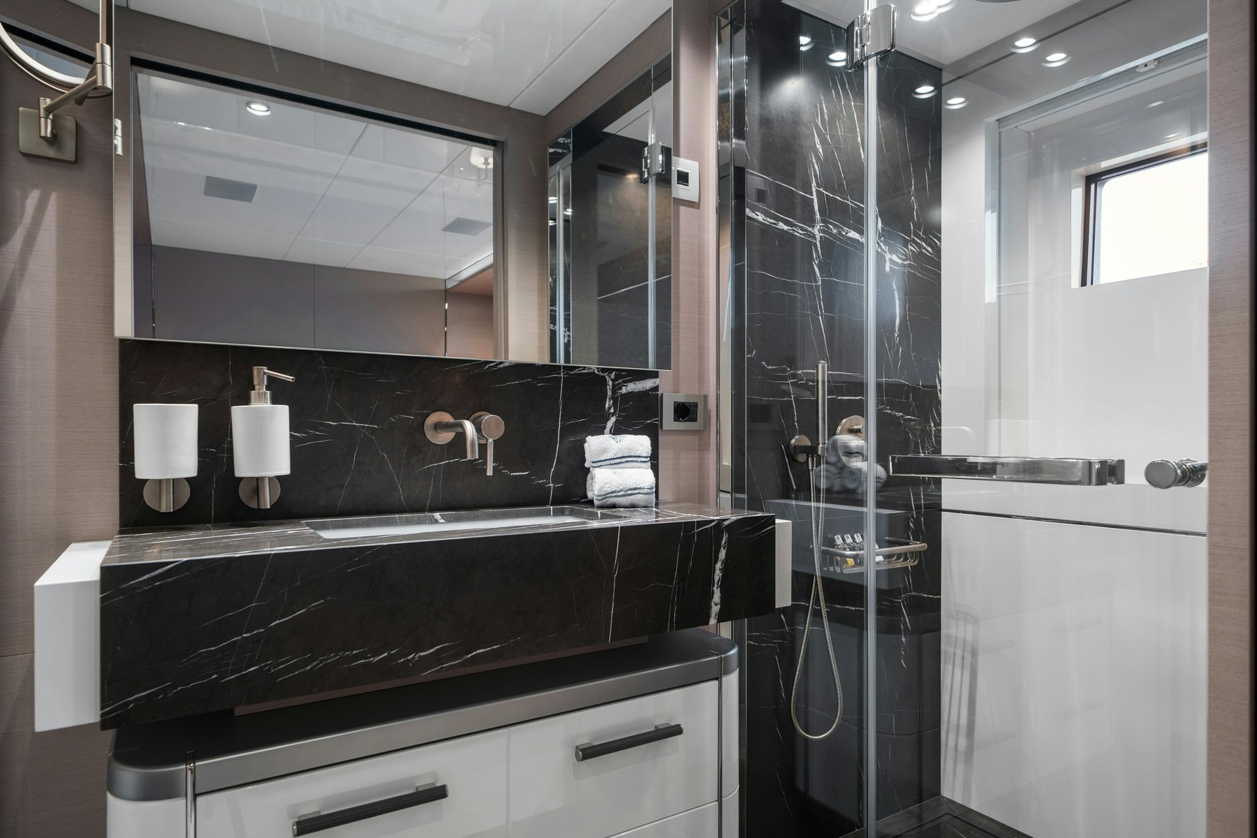 a bathroom with a large black countertop aboard CAPE COD II Yacht for Sale
