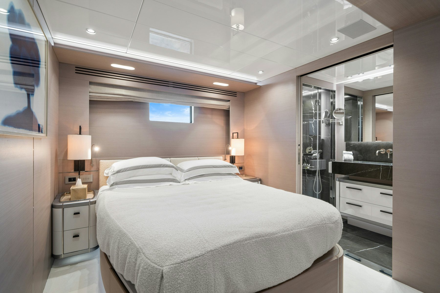 a bedroom with a bed and a mirror aboard CAPE COD II Yacht for Sale
