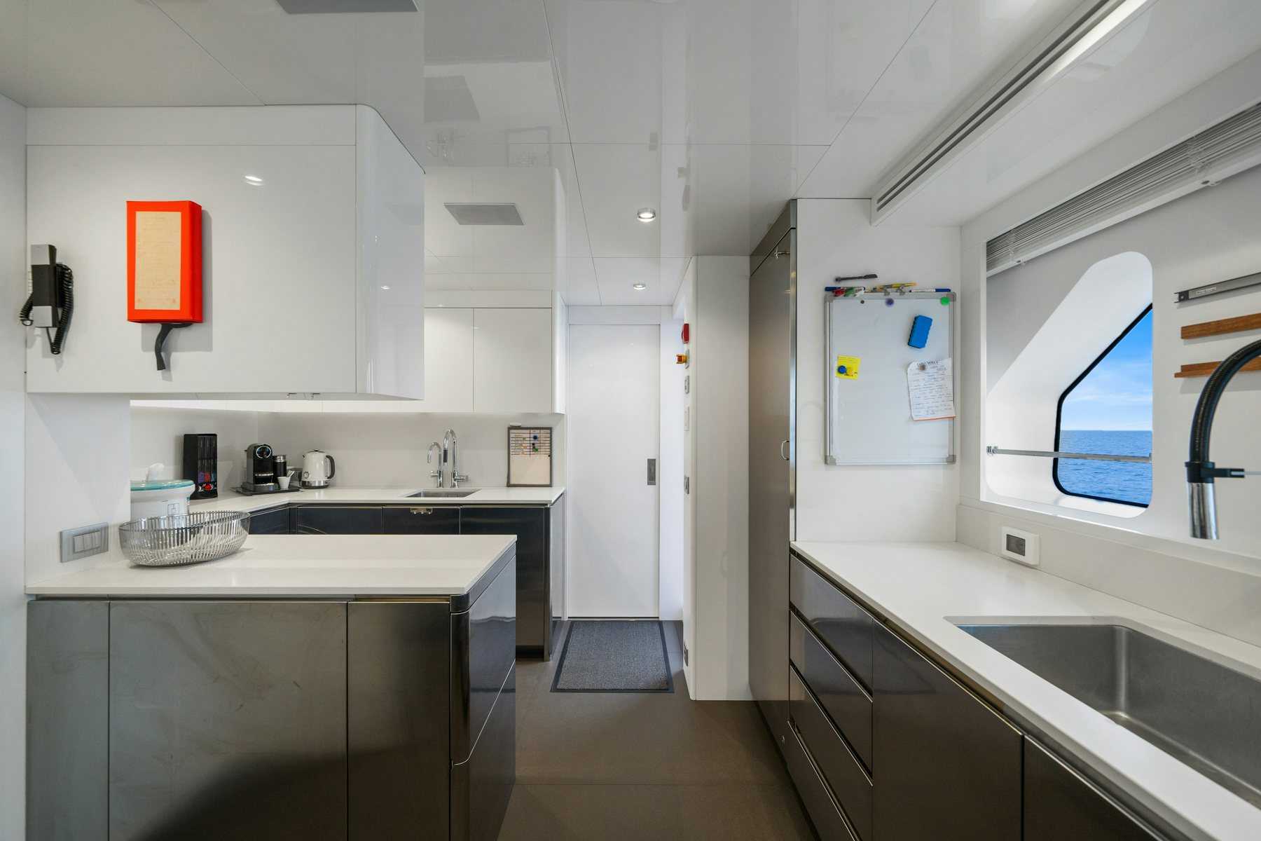 a kitchen with a sink and cabinets aboard CAPE COD II Yacht for Sale