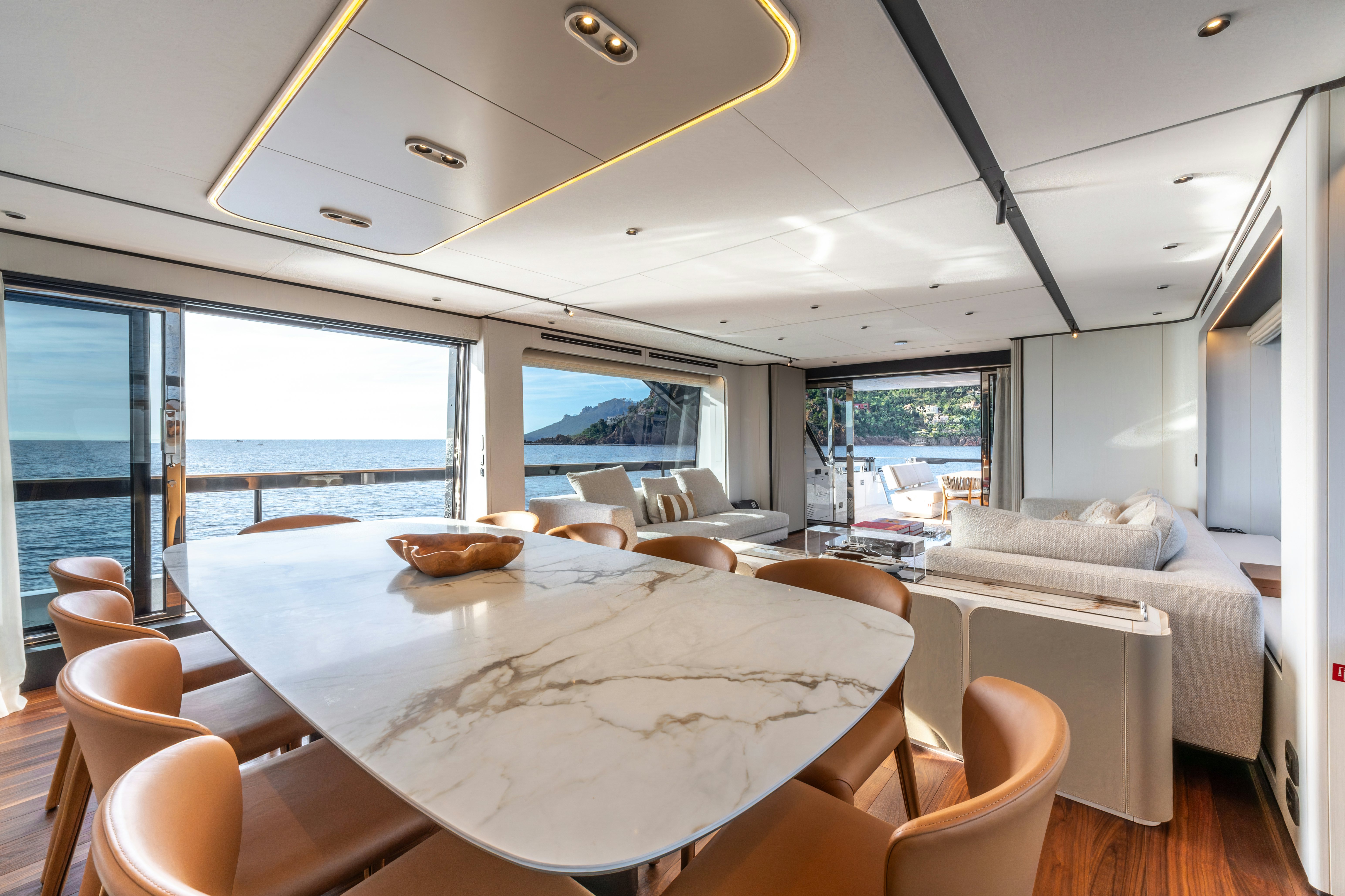 a large dining table in a room aboard TOGETHER Yacht for Sale