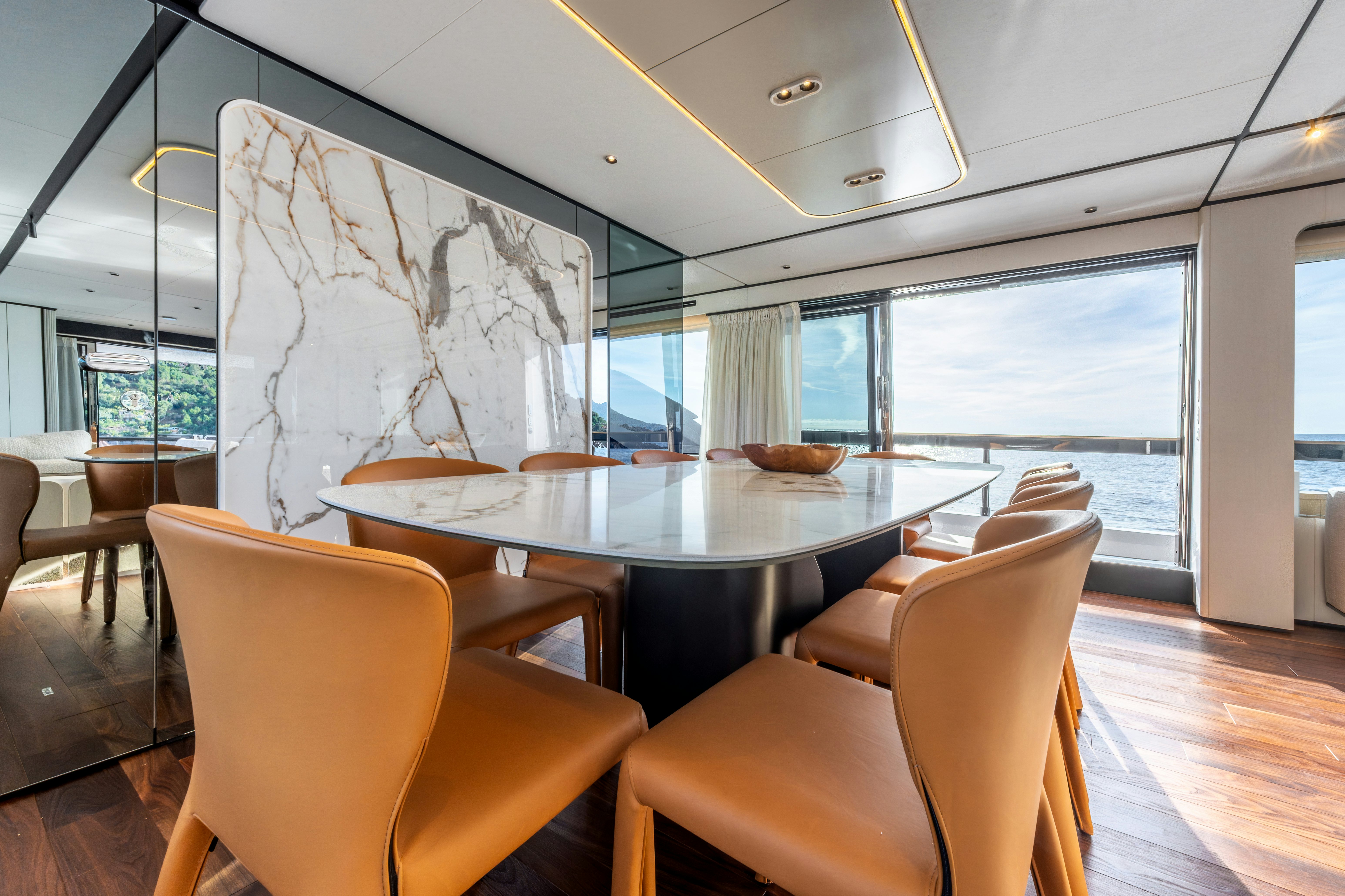 a large dining table in a room aboard TOGETHER Yacht for Sale