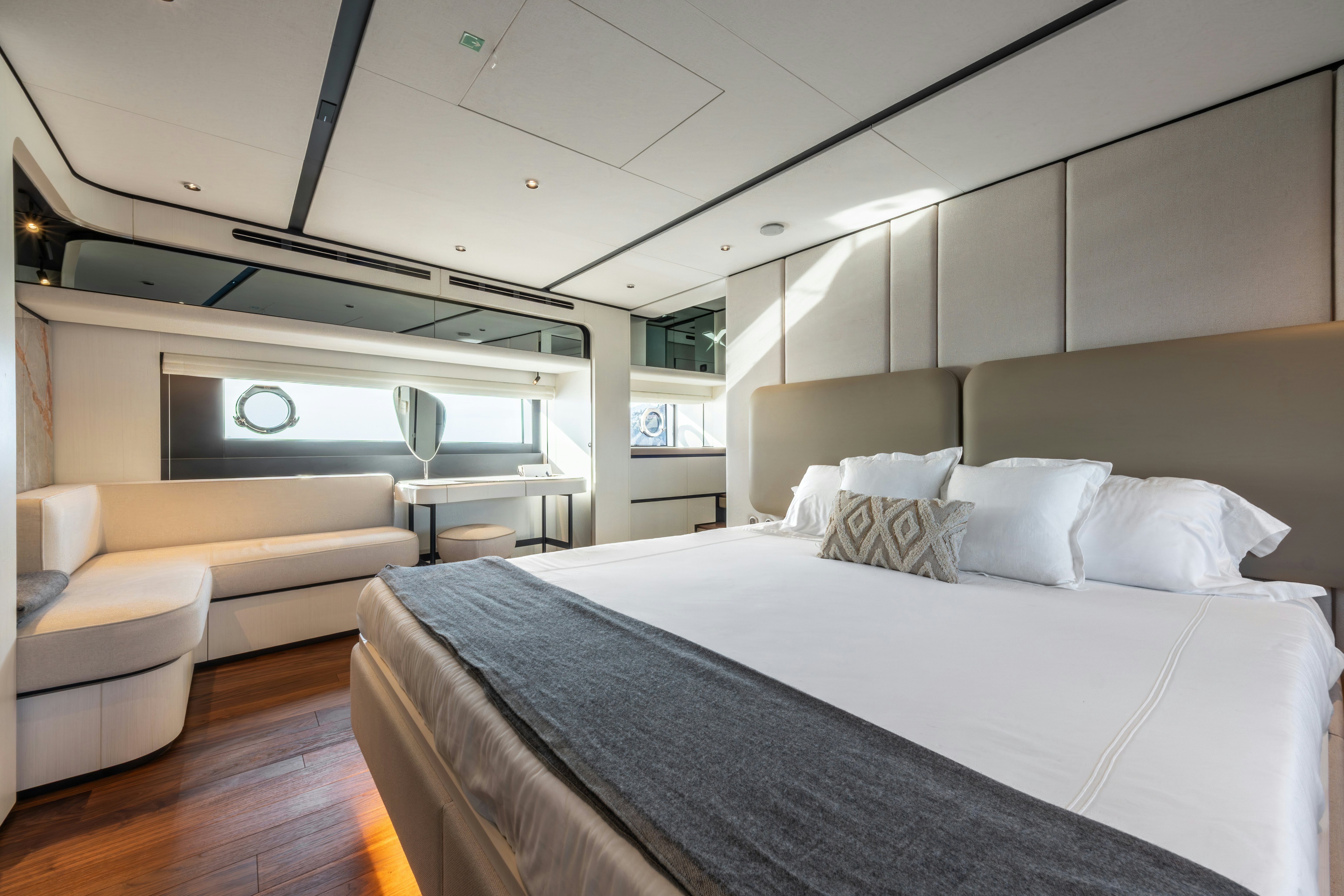 a room with a bed and a couch aboard TOGETHER Yacht for Sale