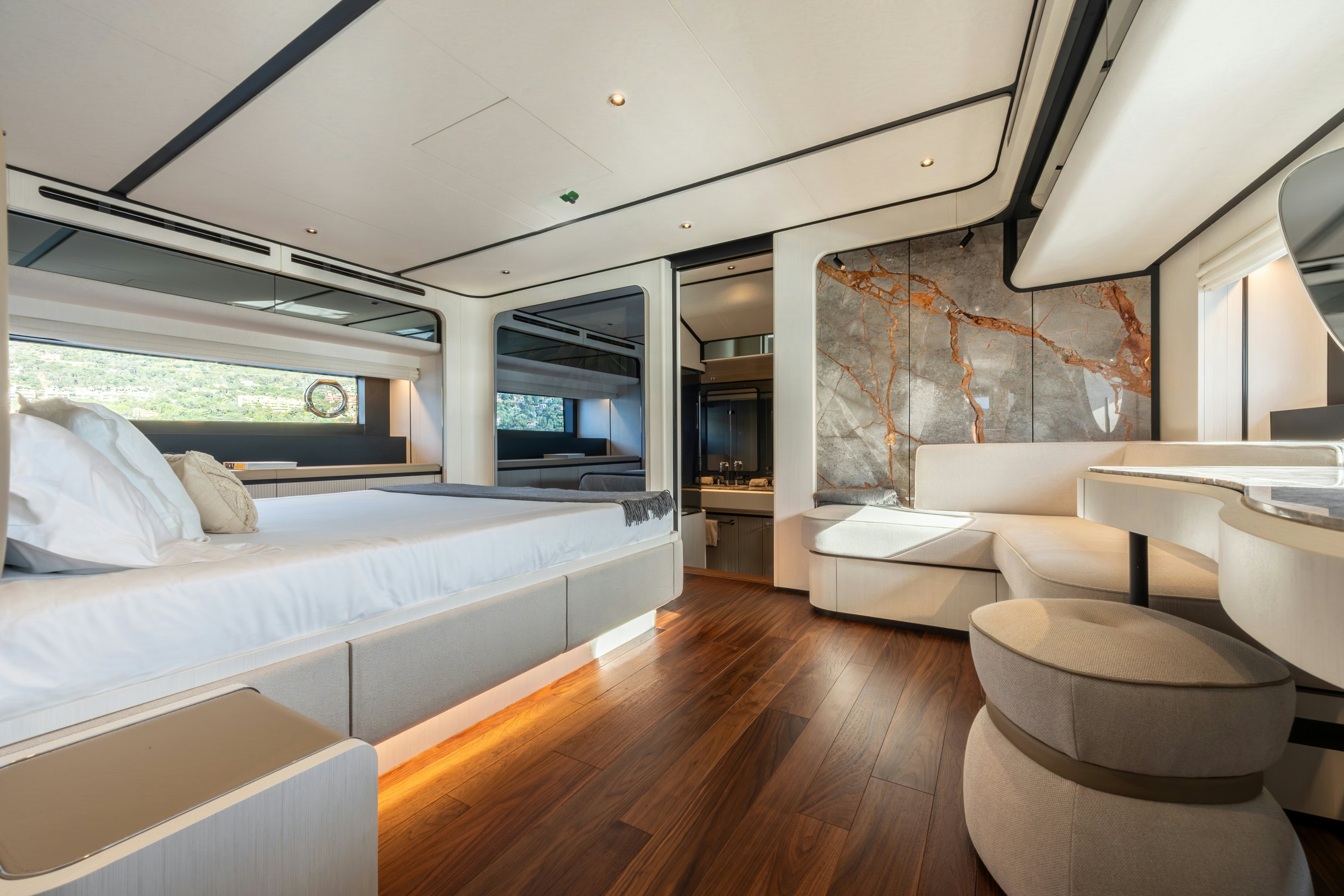 a room with a bed and a couch aboard TOGETHER Yacht for Sale