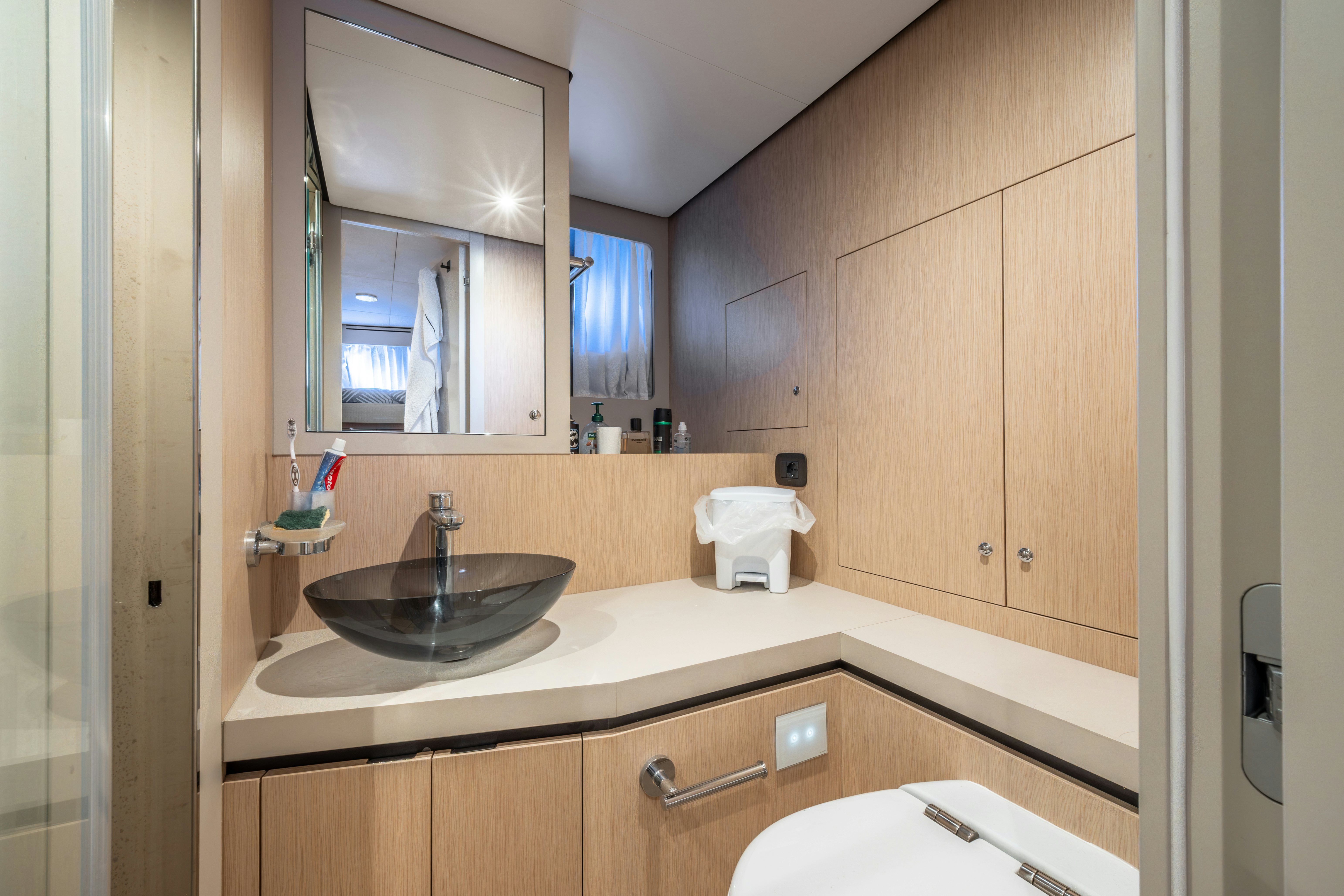 a bathroom with a sink and a mirror aboard TOGETHER Yacht for Sale